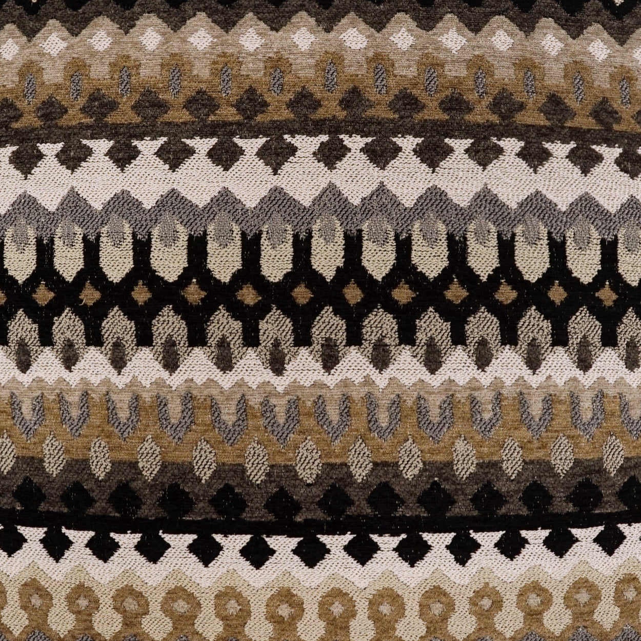 Pillow with a woven geometric zigzag and diamond pattern in earth tones (brown, tan, beige, black, cream); 24" x 24