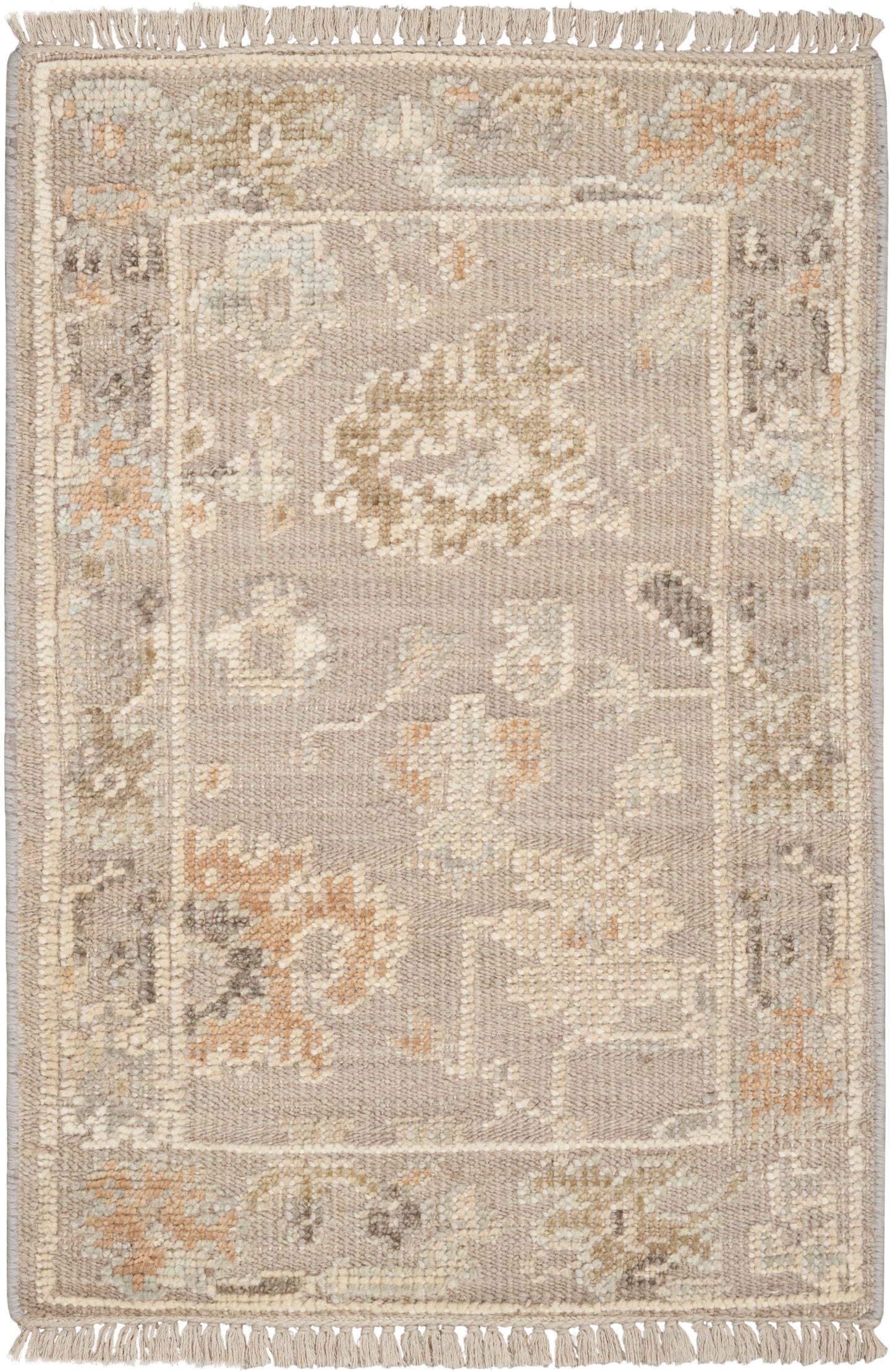 Soft gray-beige oriental rug with cream floral medallion & peach accents, framed border & fringe edges.