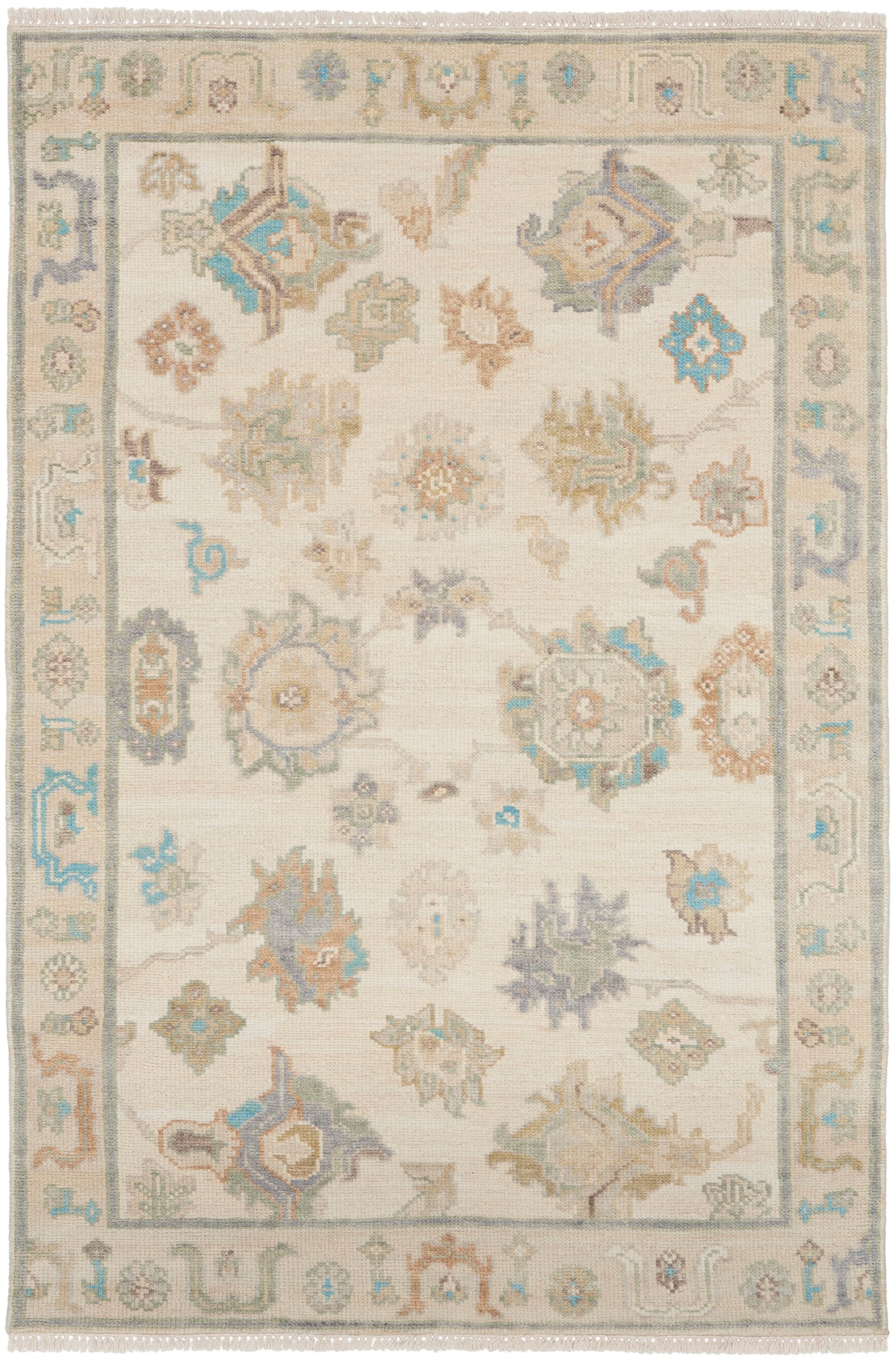 Soft beige oriental area rug with pastel blue, sage, taupe floral medallions and a bordered pattern; fringe edges.
