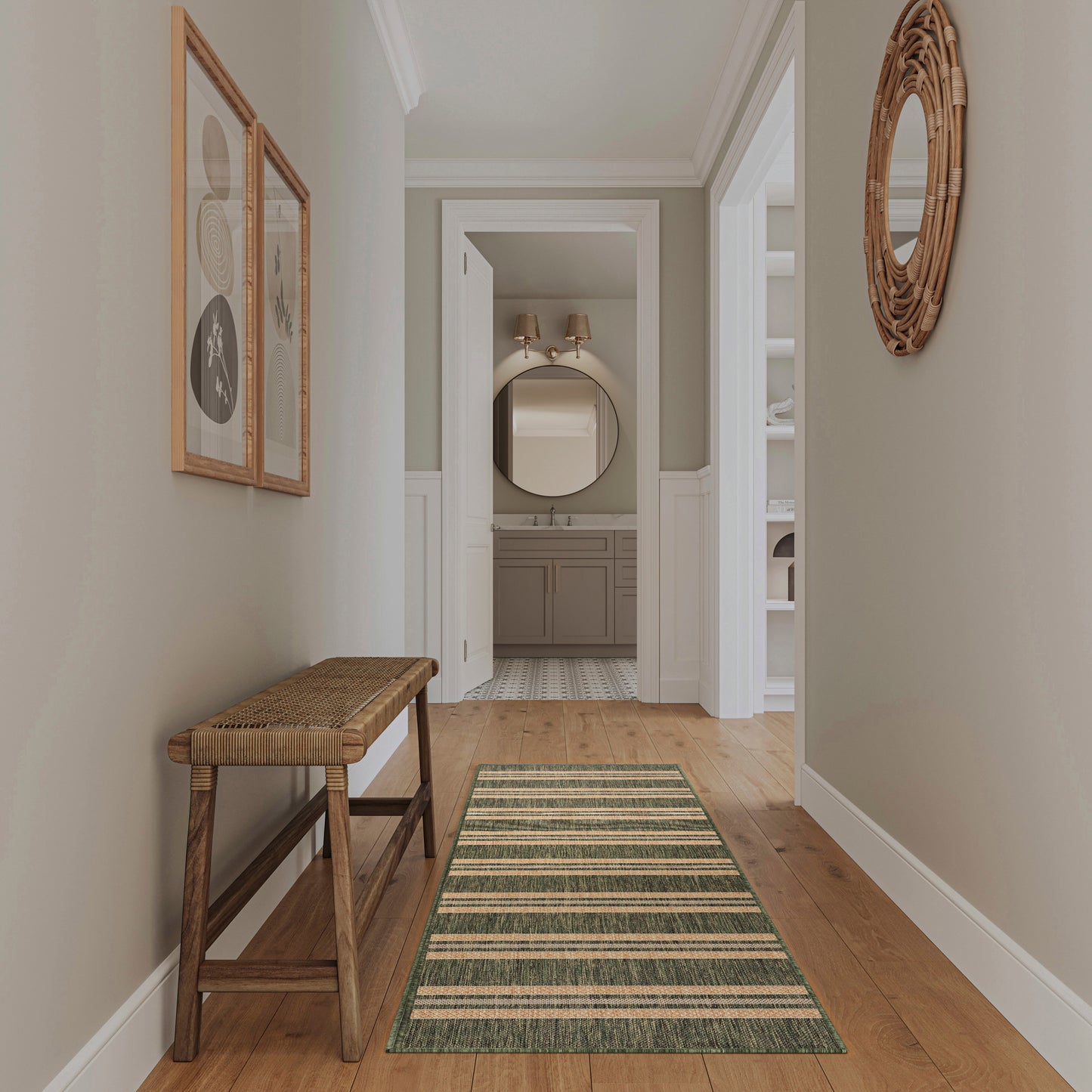 Rustic hallway with wooden bench, green striped runner rug, beige walls, wicker round mirror, framed art.