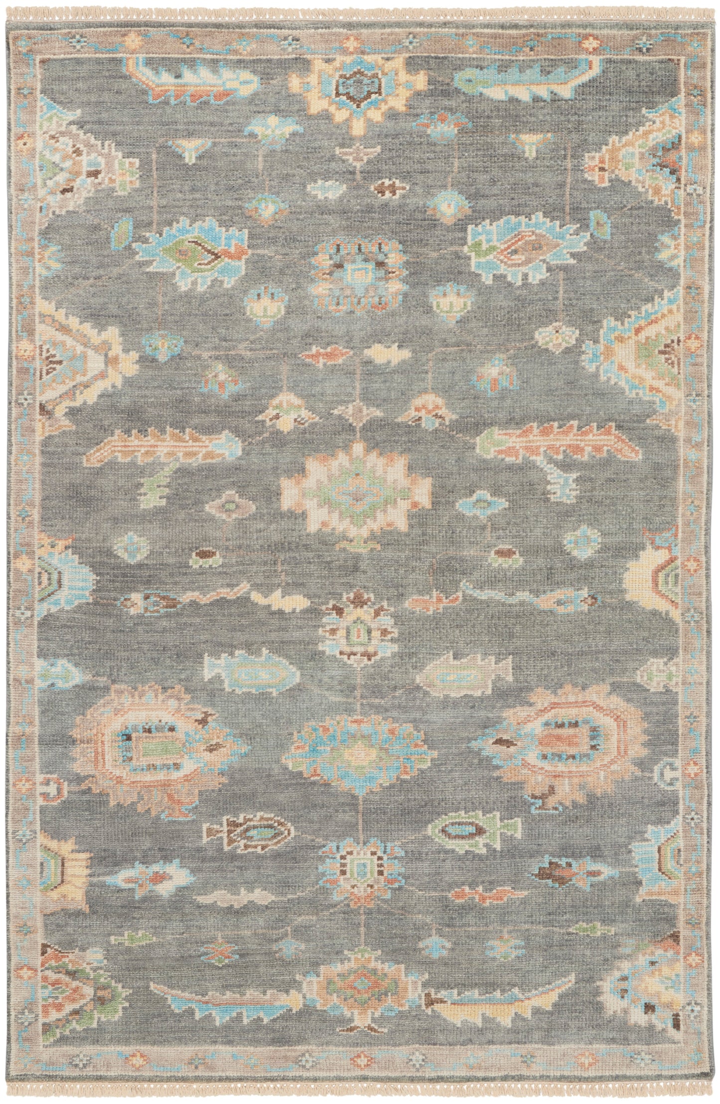 Gray-blue oriental area rug with pastel floral/arabesque motifs, cream fringe at ends, and a Persian-inspired border.