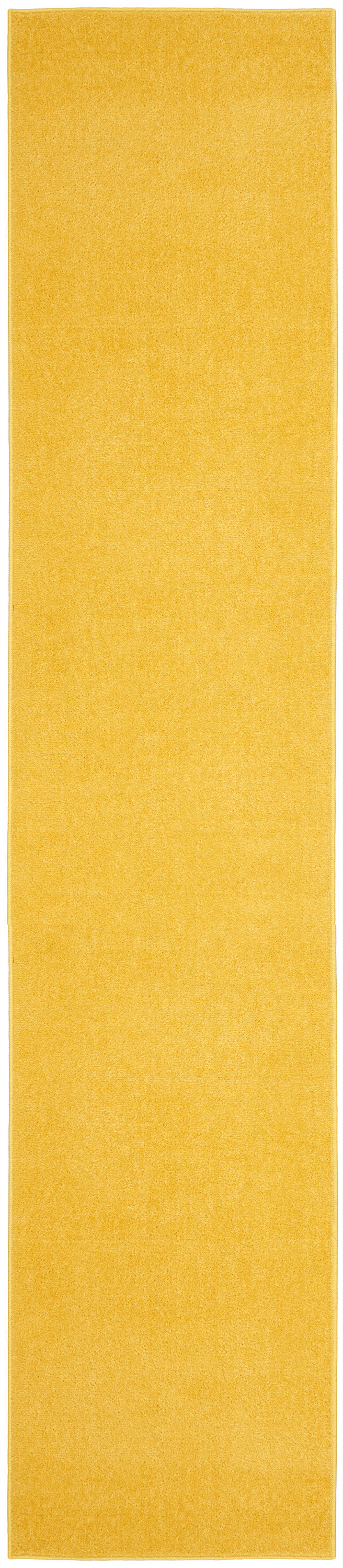 Long narrow yellow outdoor runner rug with plush texture and stitched edges.