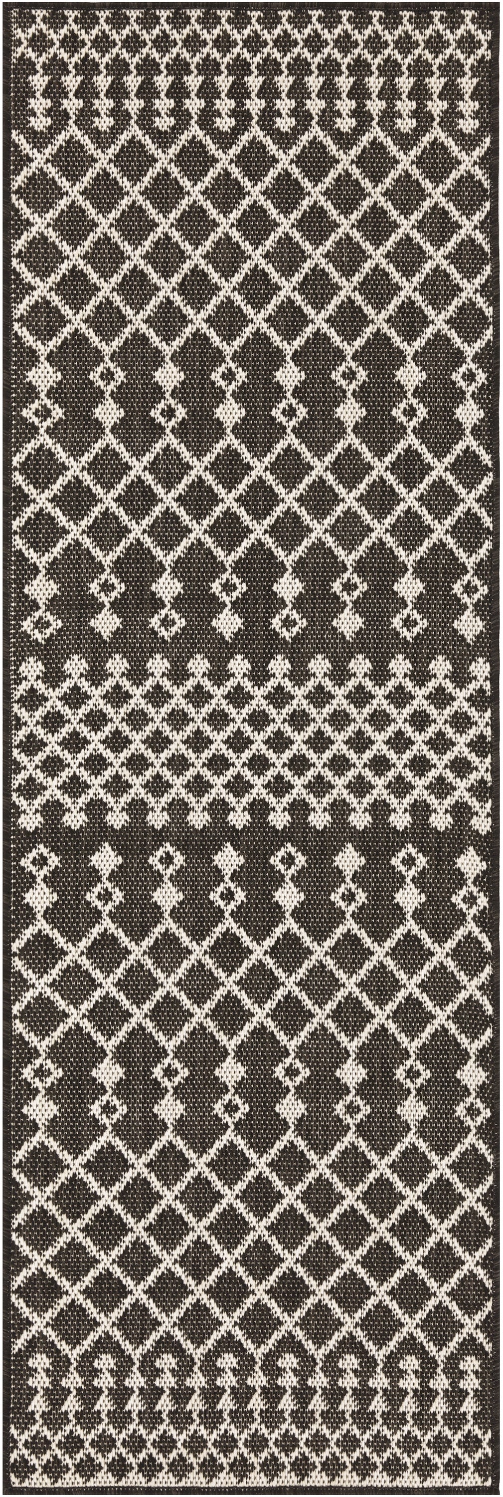 Long black-and-white woven runner with geometric diamond lattice pattern and decorative end border.