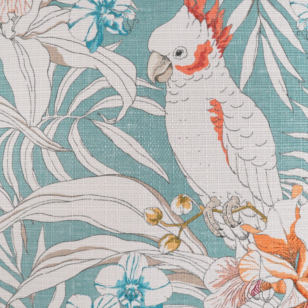 Teal linen-style fabric with white cockatoo, orange crest, pale leaves and blue flowers.