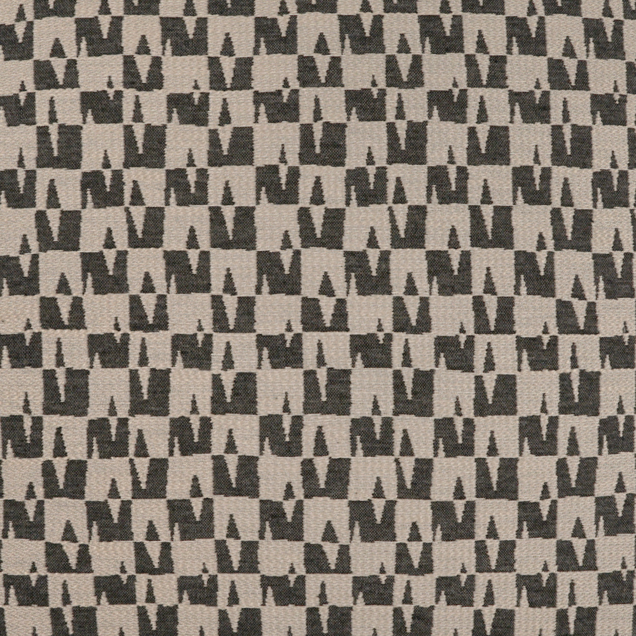 Beige woven fabric with a repeating dark gray geometric M/chevron motif.