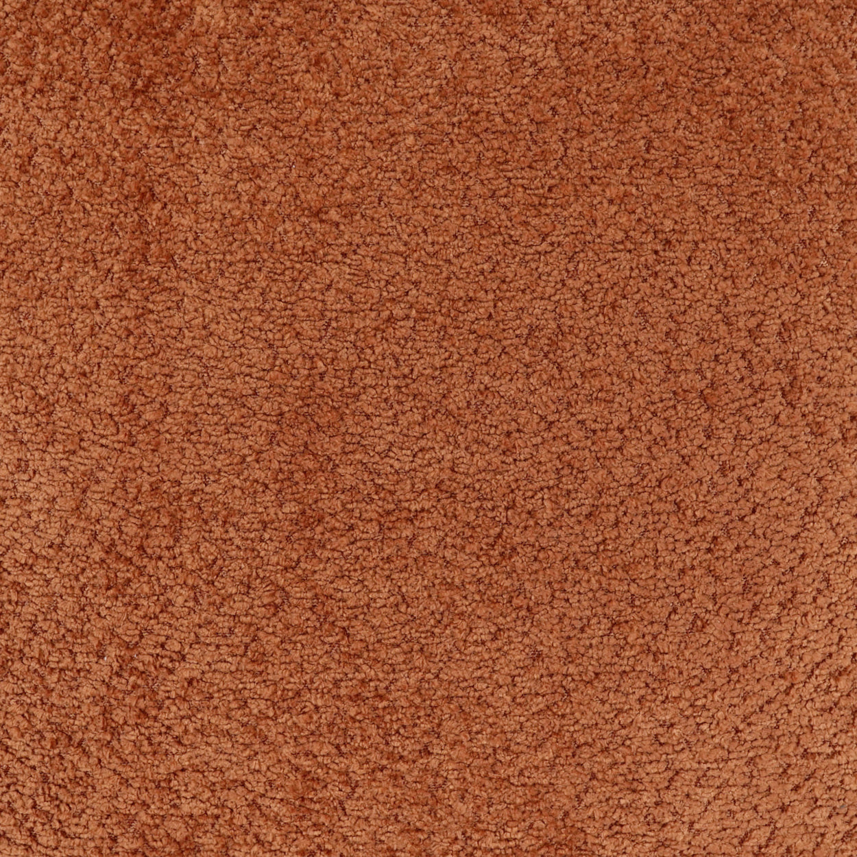 Burnt orange boucle fabric with dense loops; warm upholstery or outerwear material.