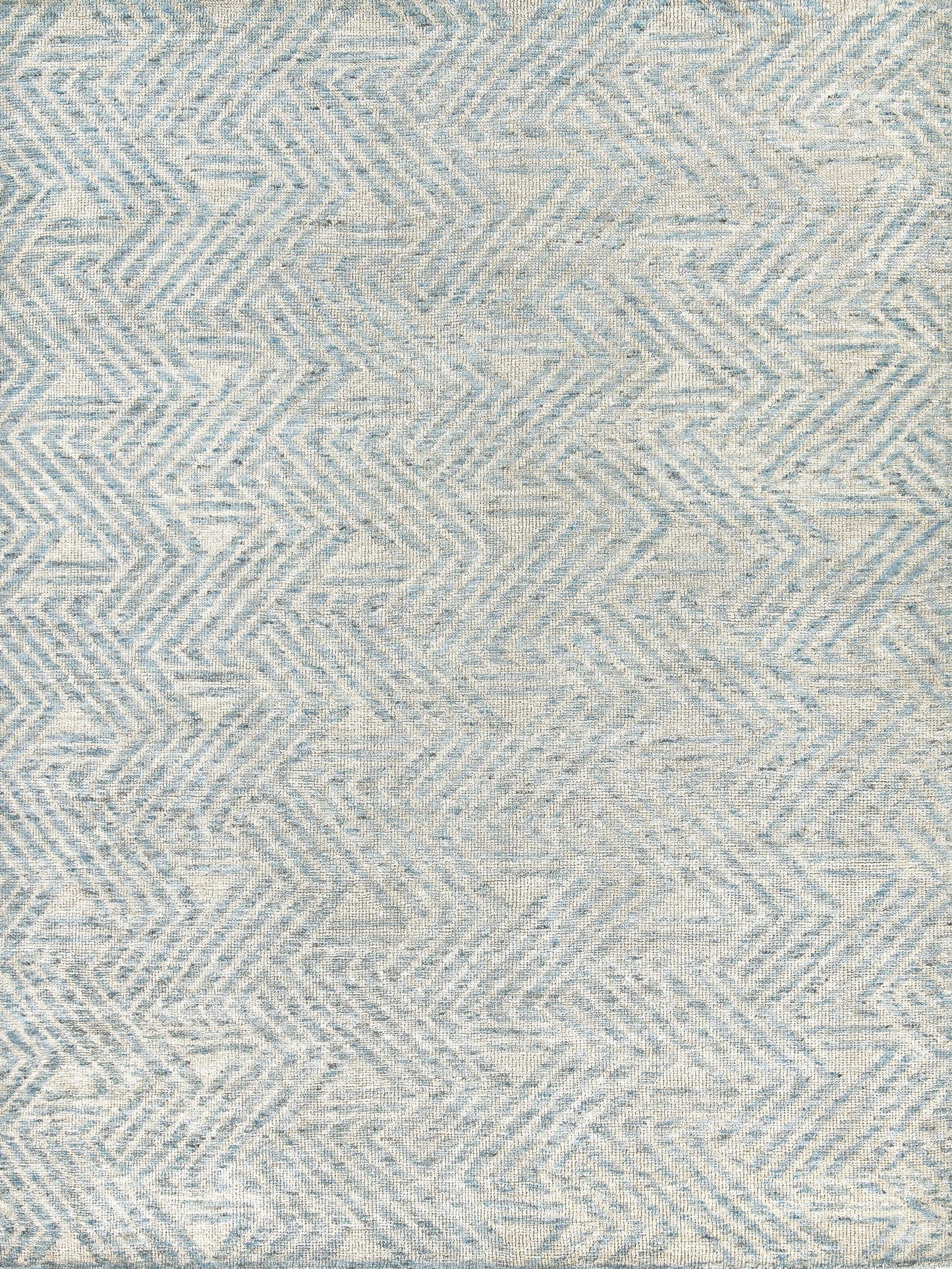 Light blue and cream geometric patterned area rug featuring a zigzag design, ideal for modern and contemporary spaces.