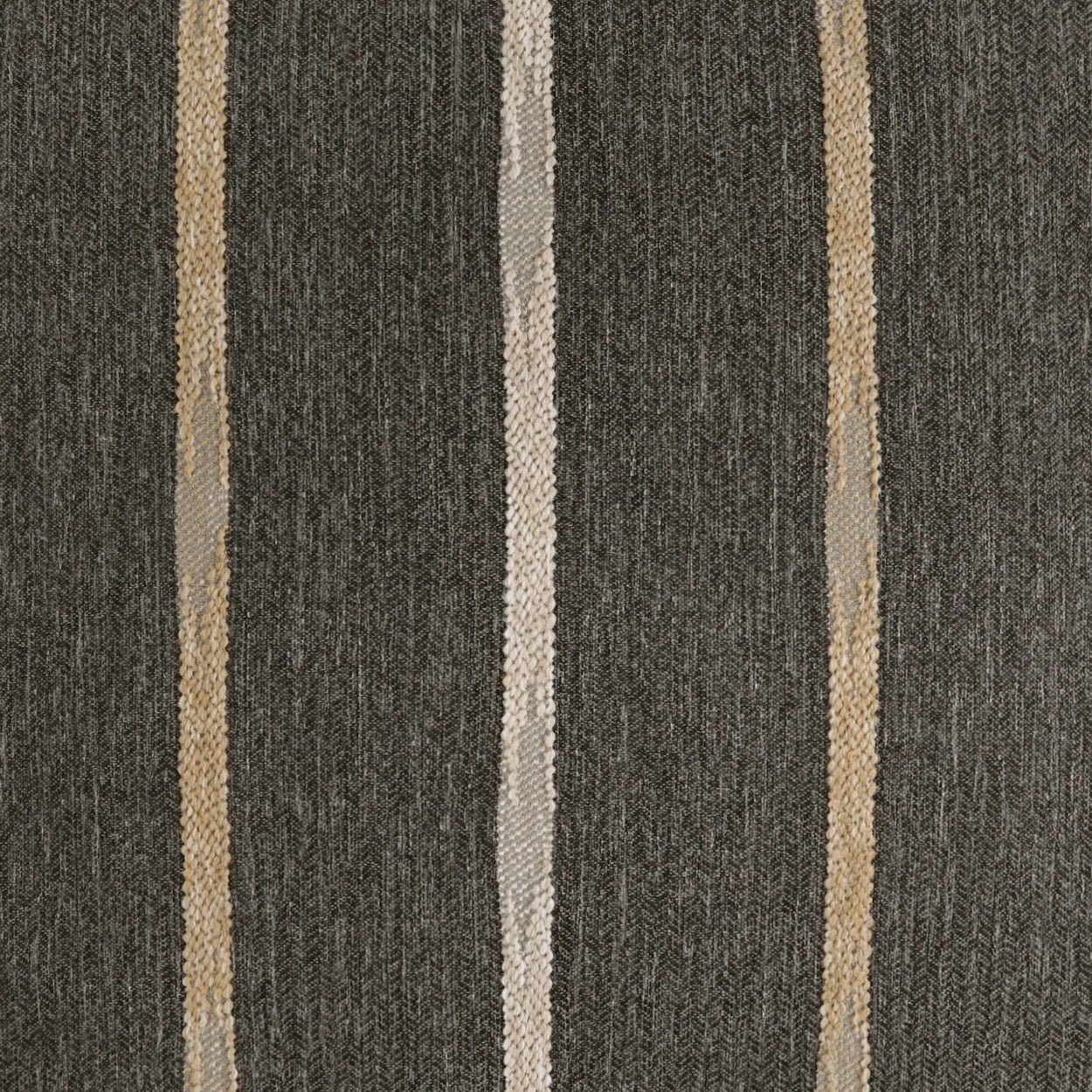 Dark charcoal fabric with vertical beige and tan stripes; woven textile suitable for upholstery or drapery.