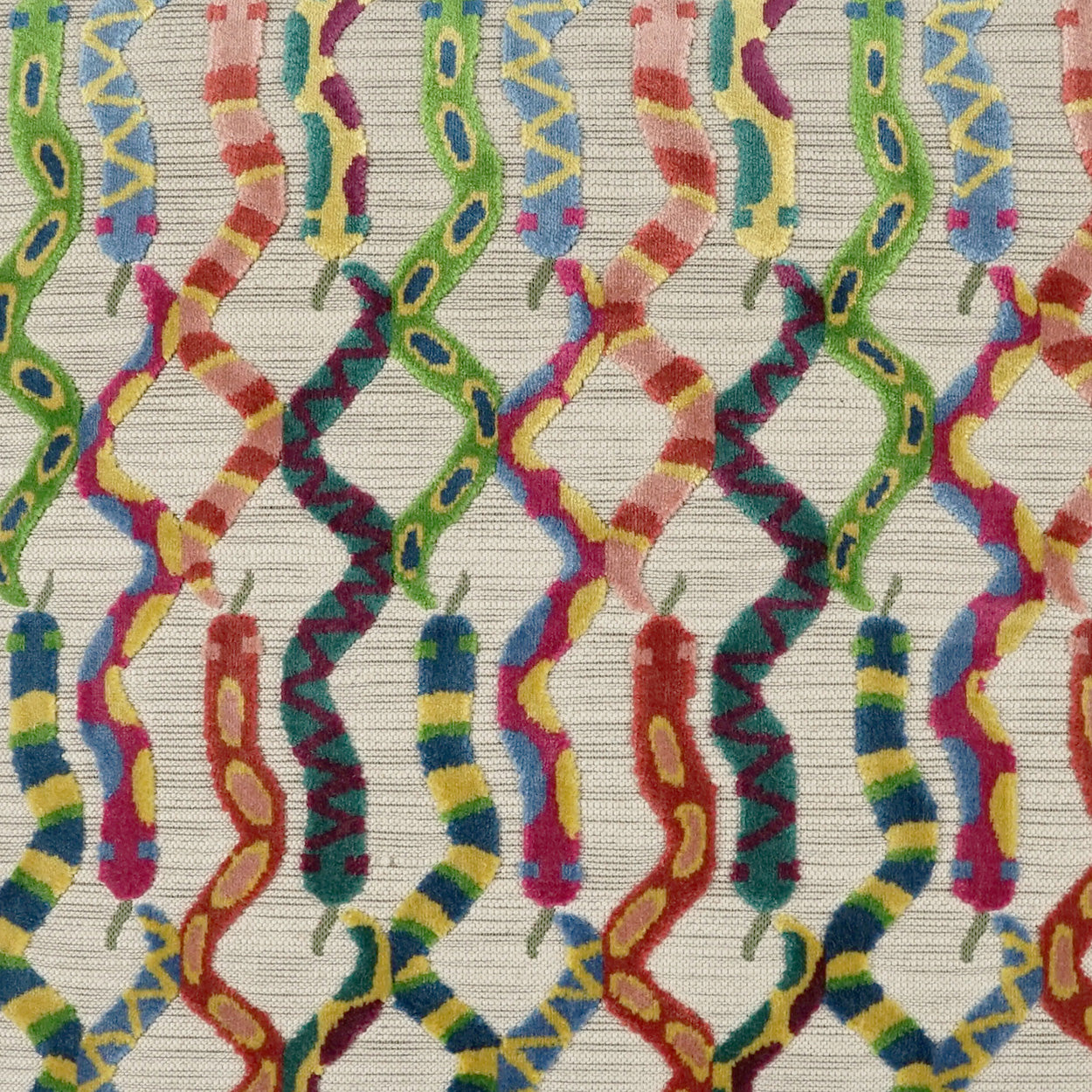 Colorful woven fabric with wavy ribbon-like strands in red, yellow, green and blue on a light striped background