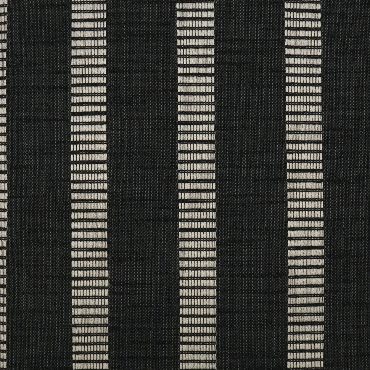 Black woven fabric with narrow light-gray vertical stripes; textured striped textile for apparel or upholstery.