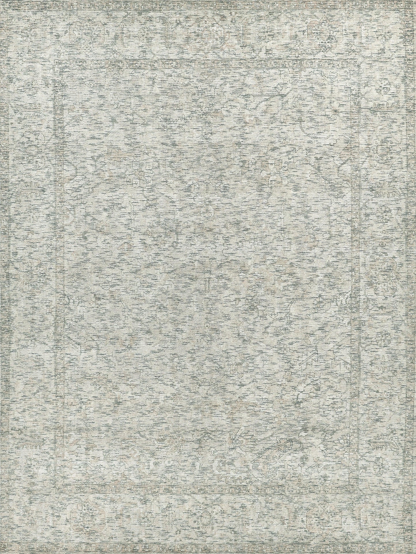 Muted grey-blue oriental-style area rug with distressed floral pattern and border.