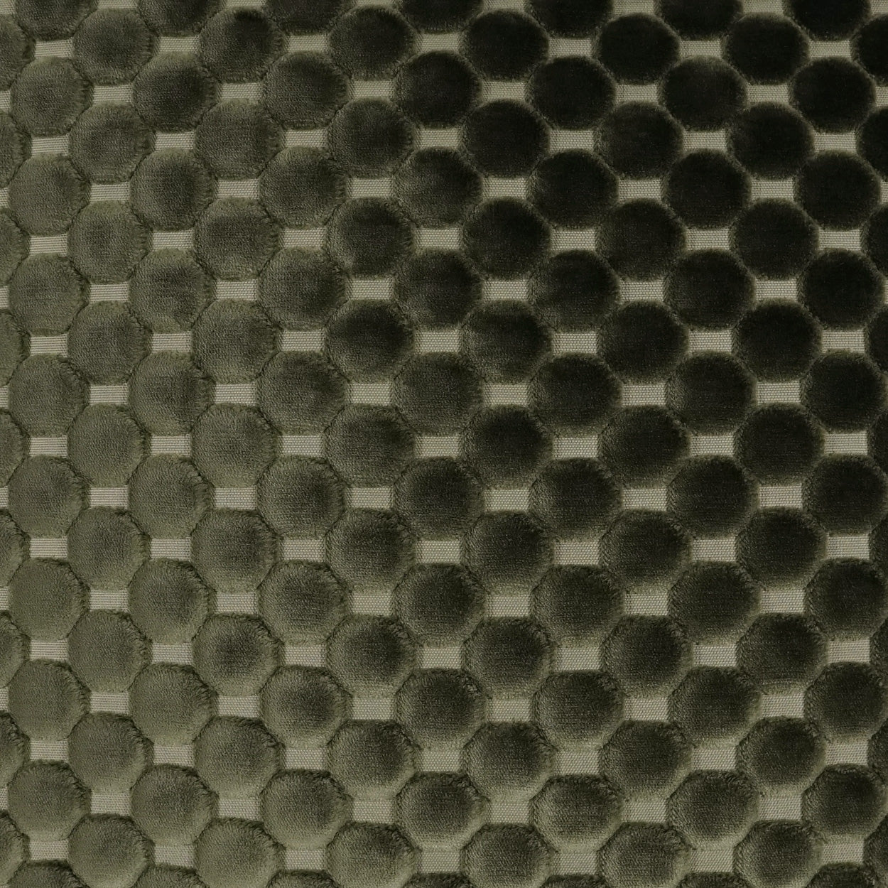 Olive-green embossed dot fabric with a hexagonal honeycomb pattern; soft textured textile for apparel or upholstery.