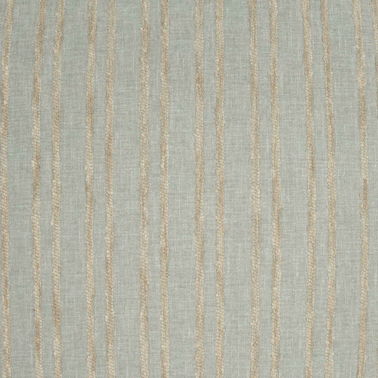 Light gray-blue pillow with beige vertical stripes and a linen-like texture