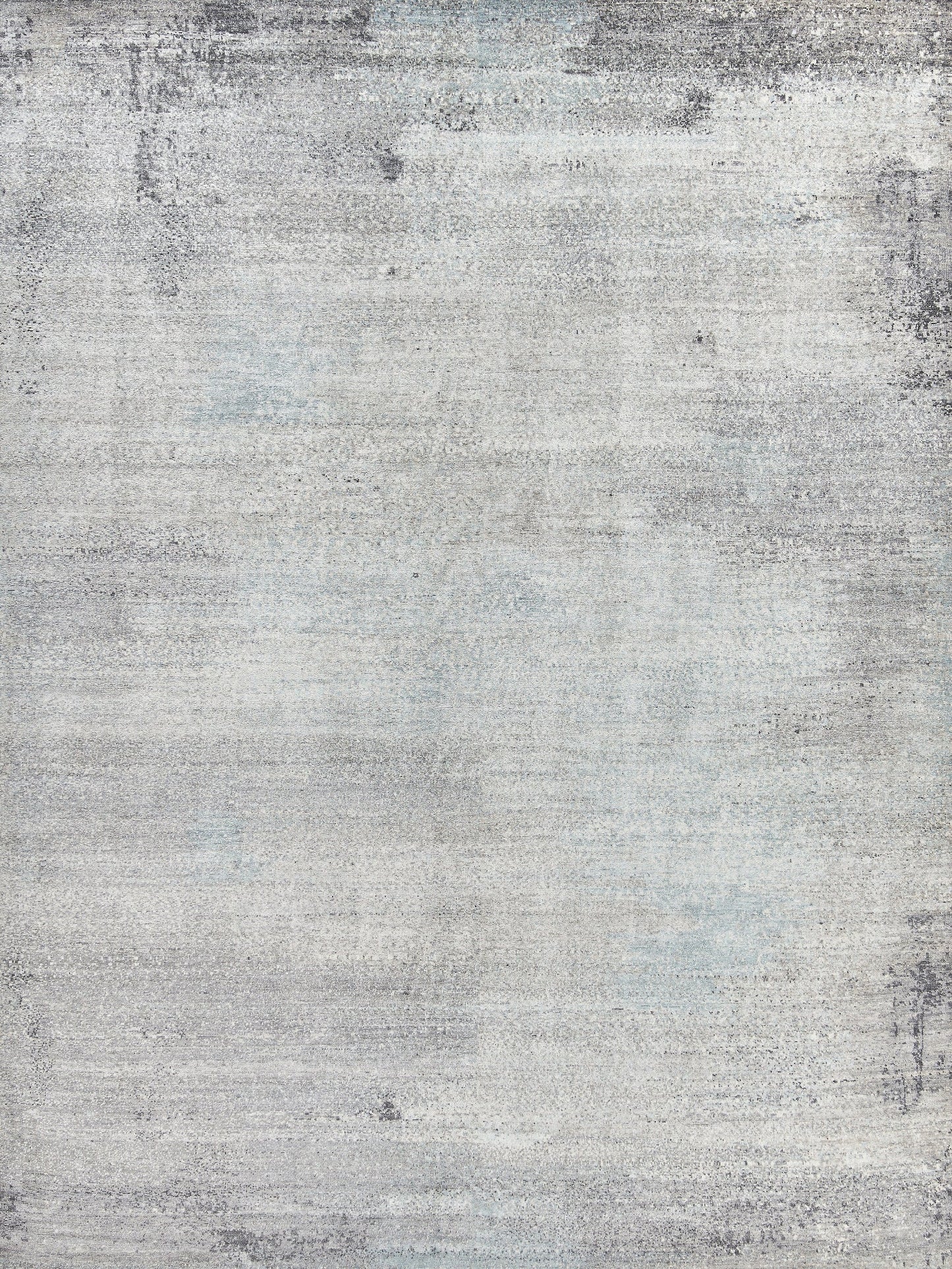 Light gray area rug with a textured pattern featuring subtle blue and darker gray streaks for a contemporary look.