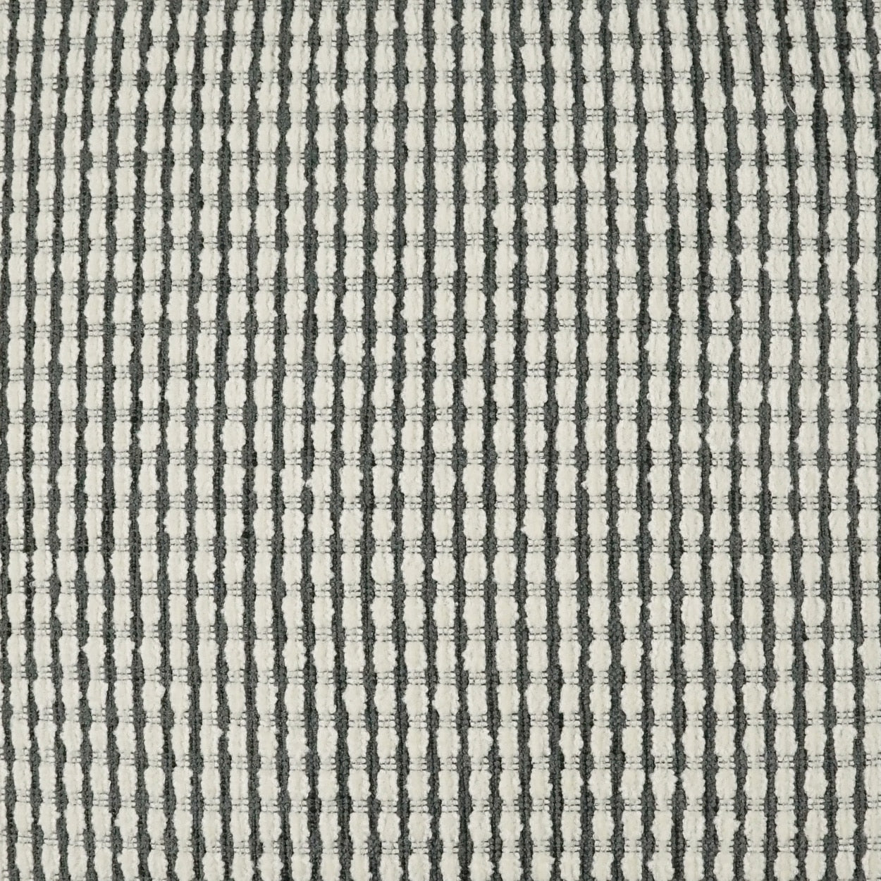 Close-up gray woven fabric with narrow vertical dark stripes and textured weave, suitable for upholstery or drapery.