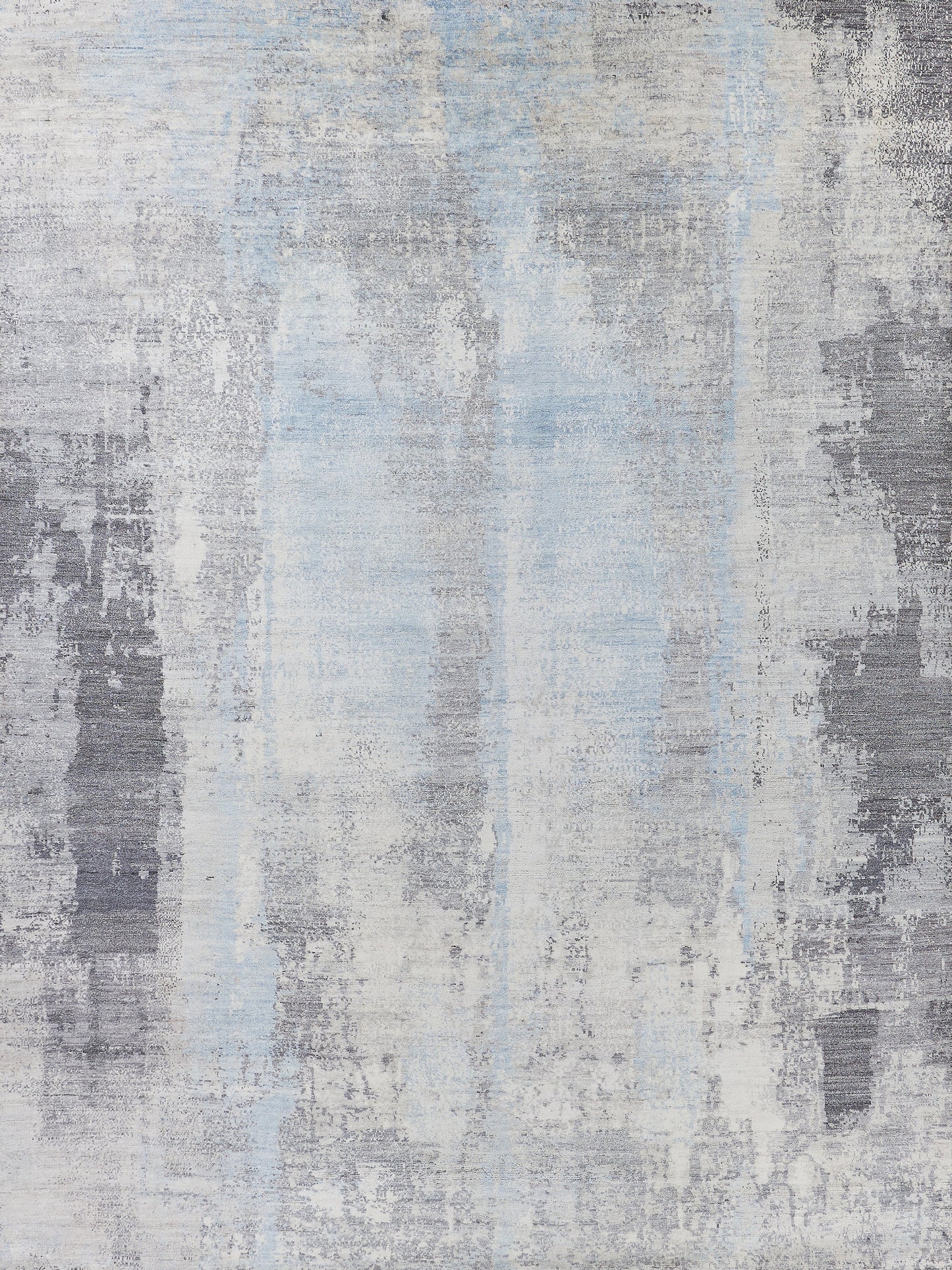 Muted abstract area rug featuring soft blues and grays in a textured pattern for modern interiors. Perfect for cozy spaces.