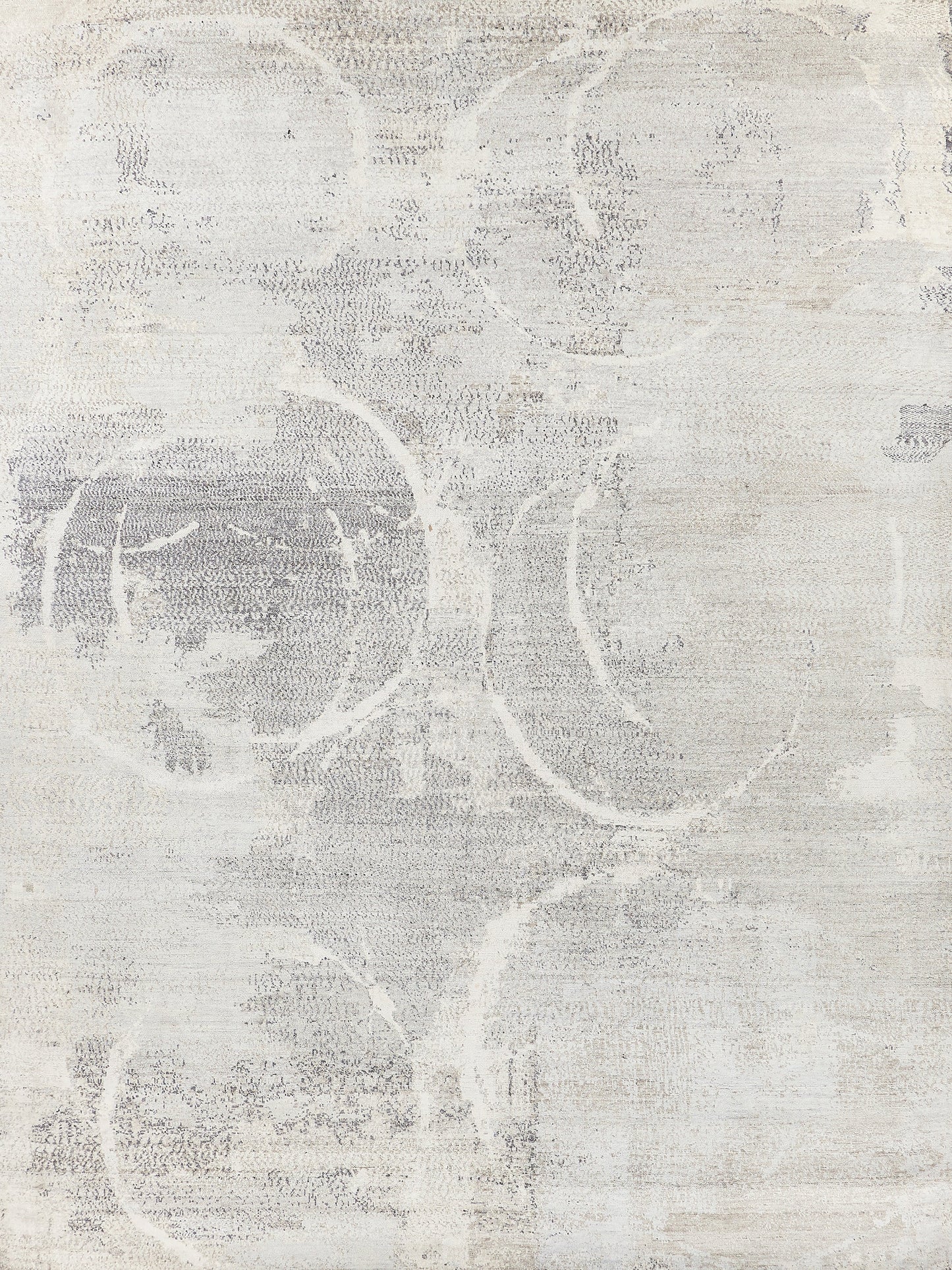 Light gray abstract area rug with circular patterns, textured weave for added depth and a modern aesthetic.