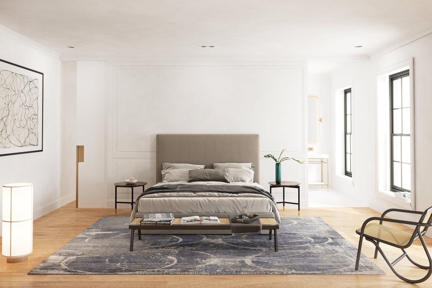 Minimalist bedroom with gray upholstered bed, blue rug, bench at foot, black nightstands, plant, floor lamp, and windows.