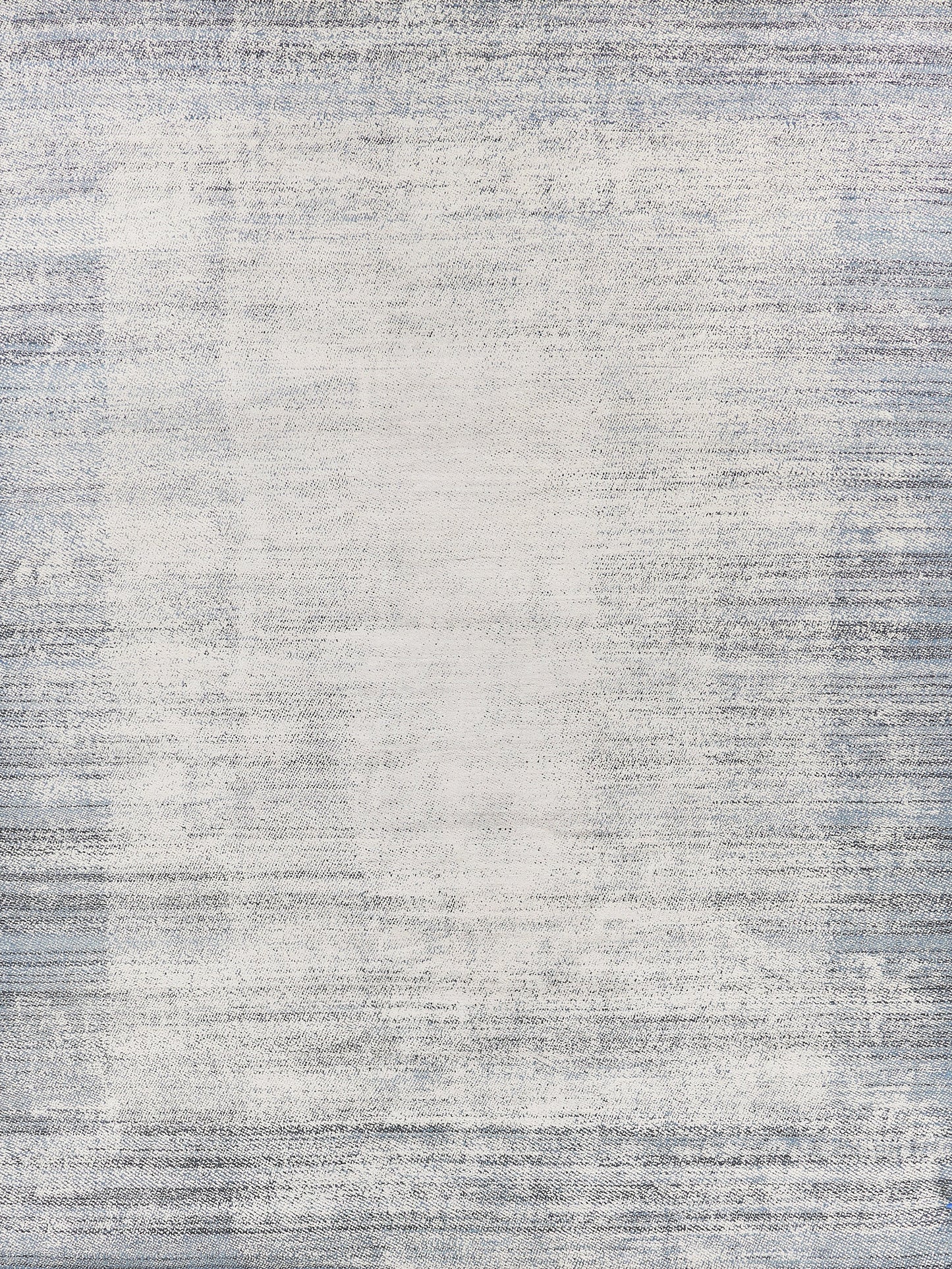 Abstract area rug featuring a gradient of soft whites and light blues, with a textured, woven appearance for modern decor.