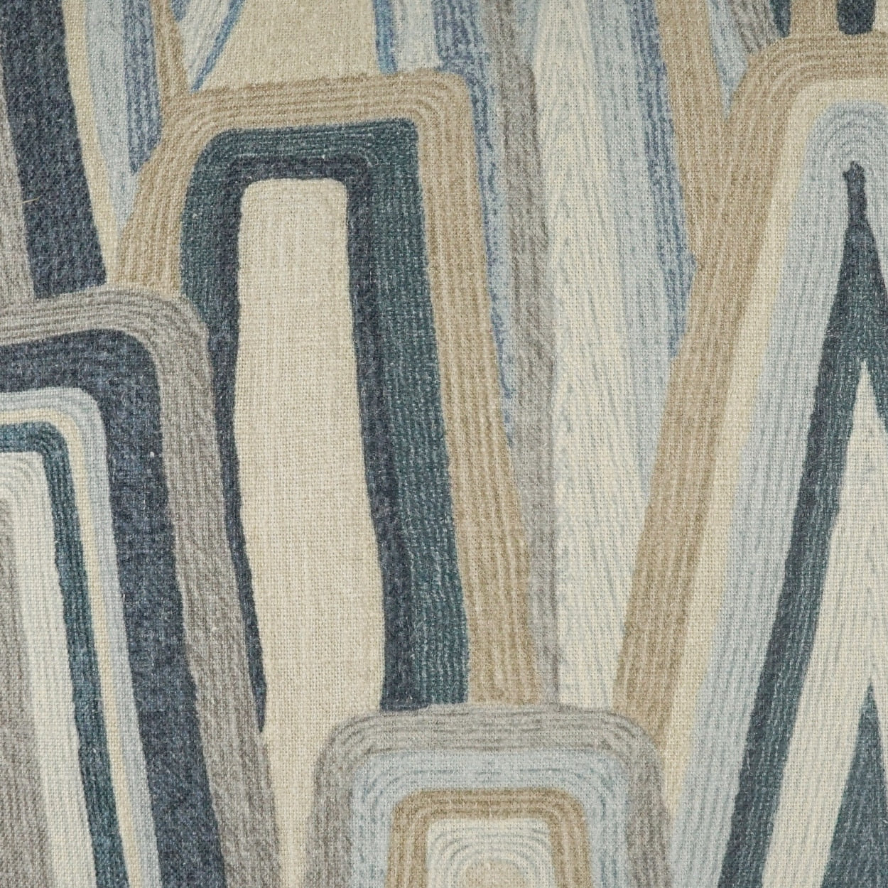 Abstract geometric fabric pattern of nested rounded-rectangle shapes in blue, beige, tan and gray.