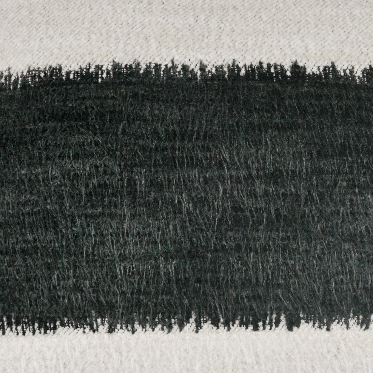 Beige woven fabric with a wide black frayed band across the center; rustic fringe trim for scarves or home decor.