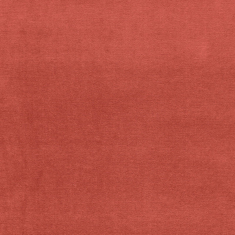 Rust-orange velvet close-up showing a soft nap; versatile for upholstery or apparel.