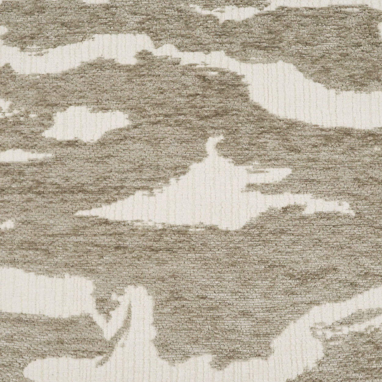 Beige and ivory abstract camo-patterned woven fabric with a soft textured surface; suitable for upholstery.