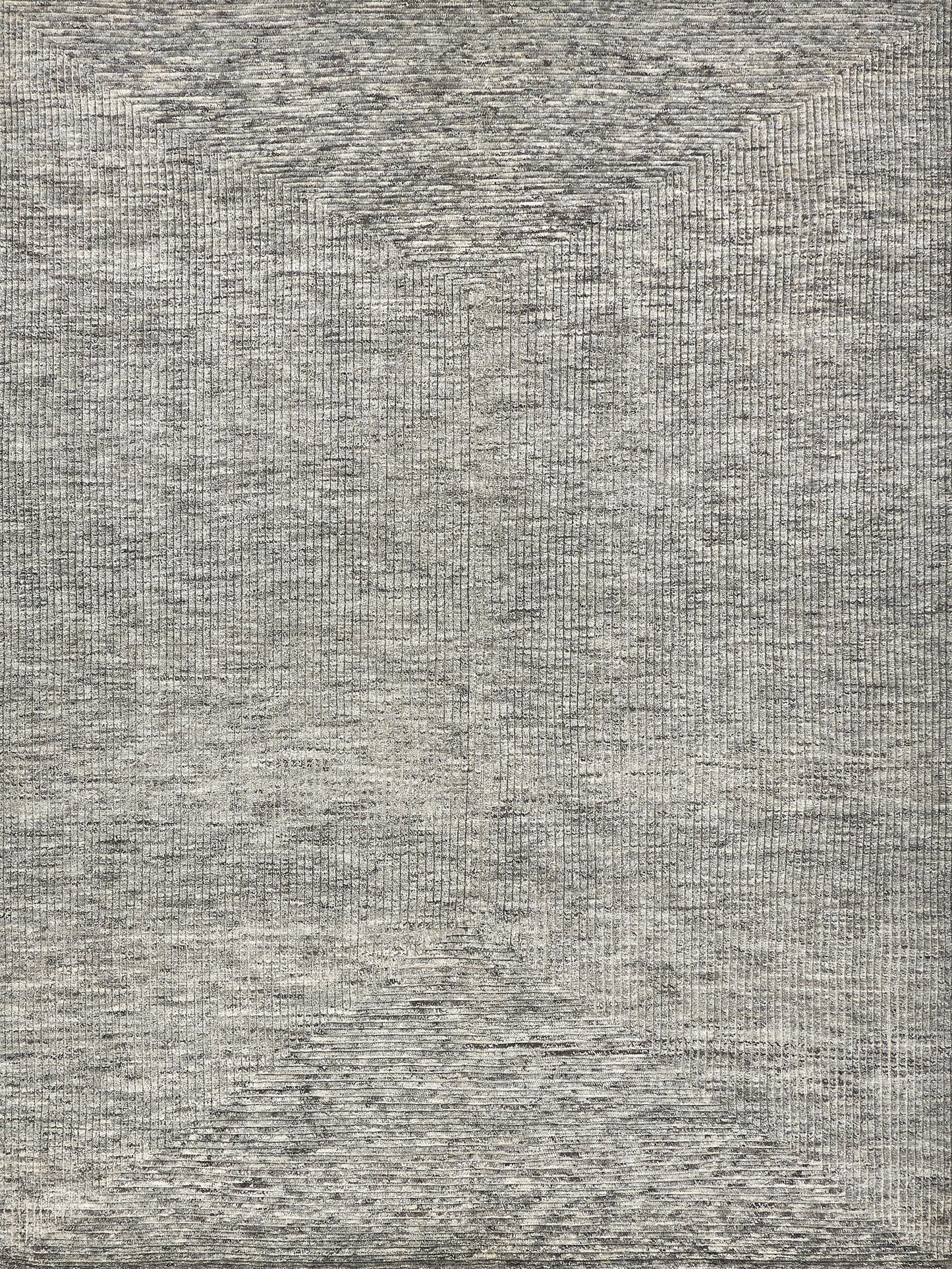 Close-up of a gray, hand-knotted rectangular rug with subtle texture and tonal variation.