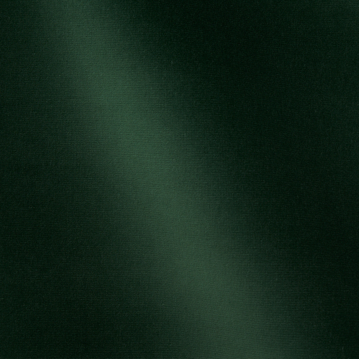 Dark green velvet fabric with a soft nap and subtle sheen, suitable for garments or upholstery.