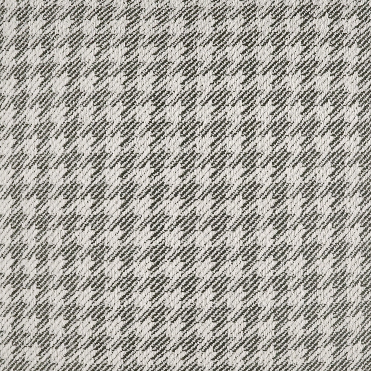 Gray and ivory herringbone fabric with diagonal chevron weave, upholstery textile.