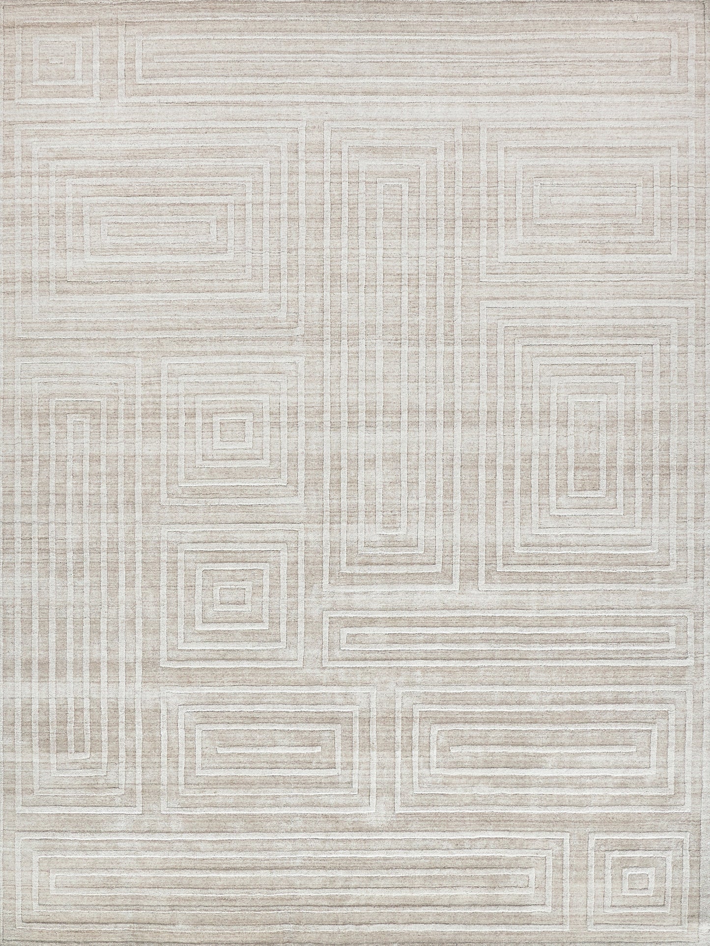 Light beige handloomed rectangle rug featuring a geometric pattern of outlined rectangles in varying sizes, creating a subtle, modern design.