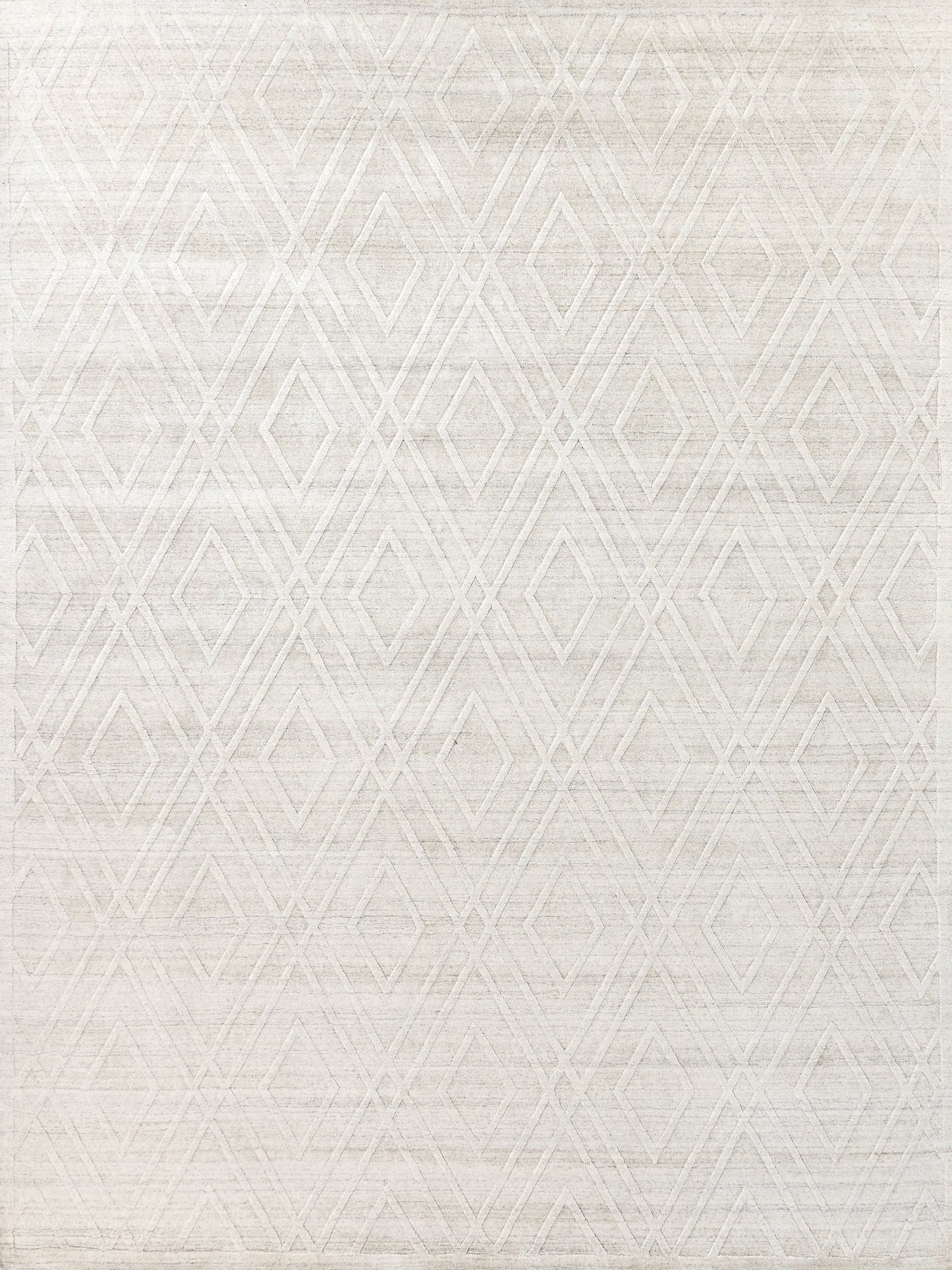 Textured white area rug featuring a geometric diamond pattern, made from soft fibers, ideal for modern and minimalist decor.