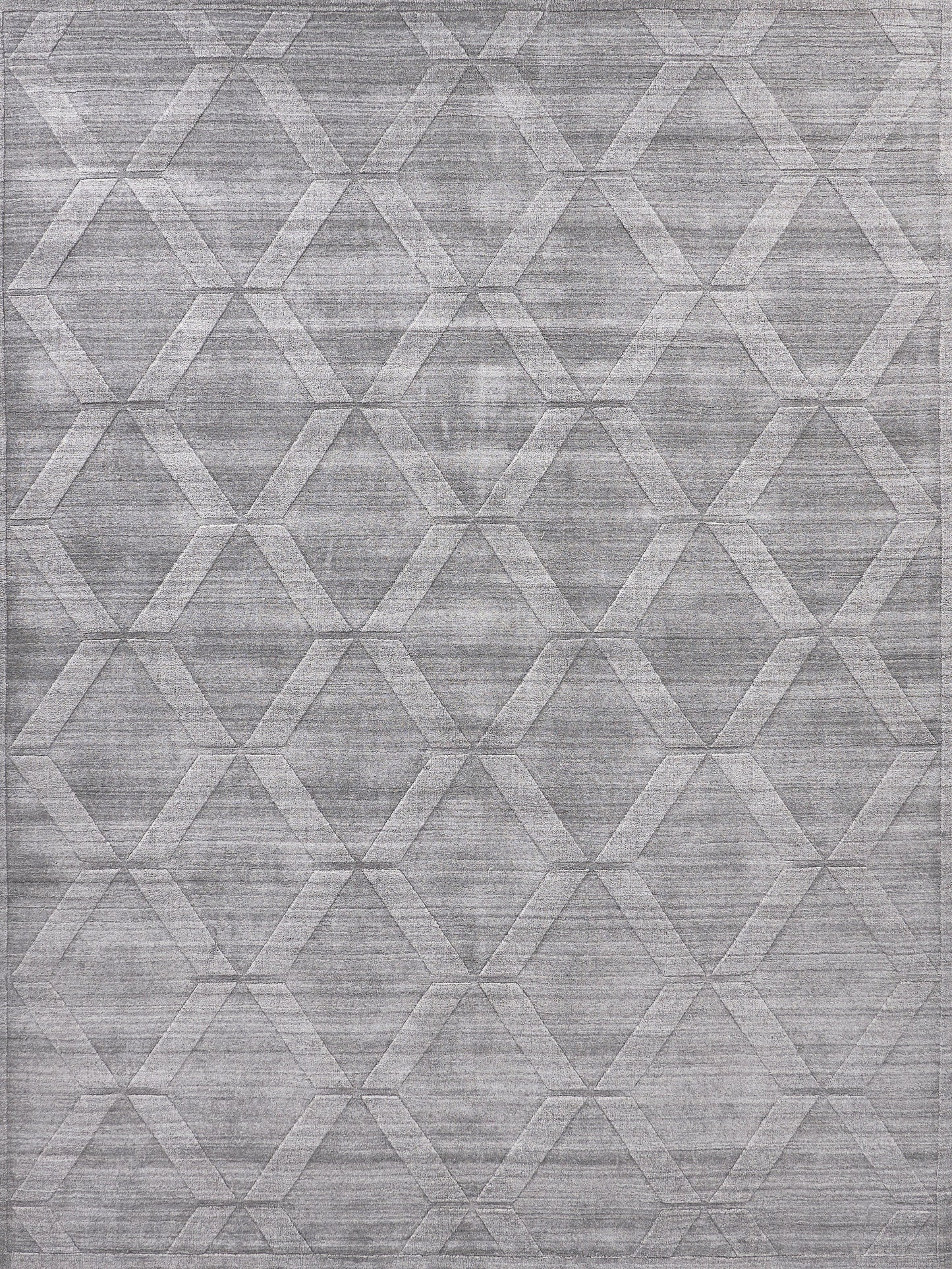 Gray geometric rug with a repeating diamond/hexagon pattern and textured weave; modern decor.