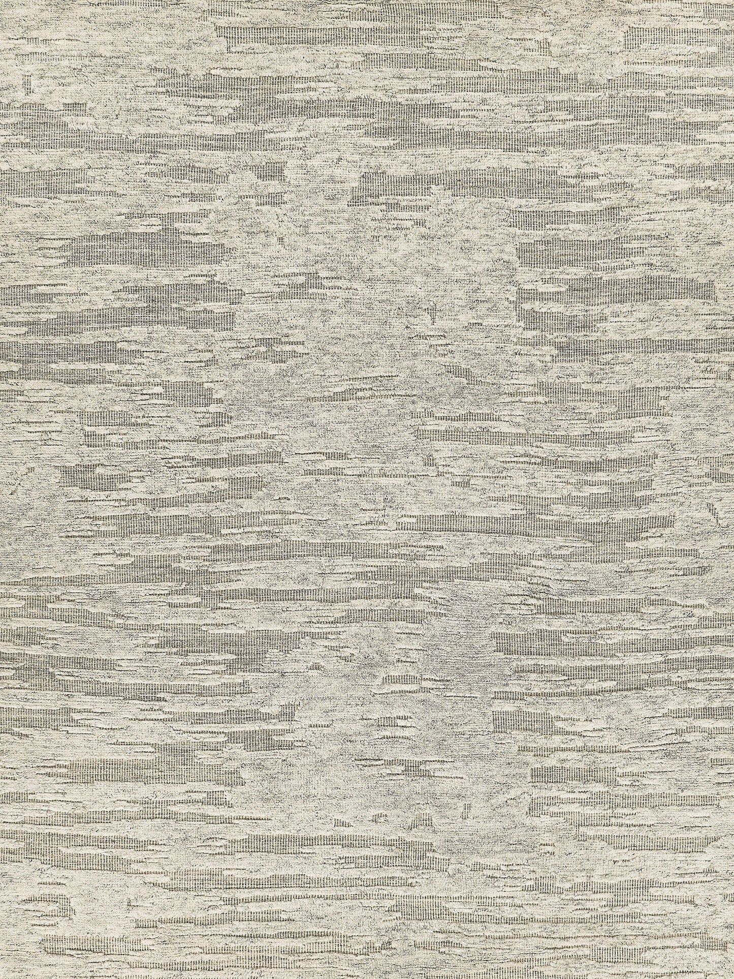 Beige-gray heathered rug texture with irregular horizontal striations.