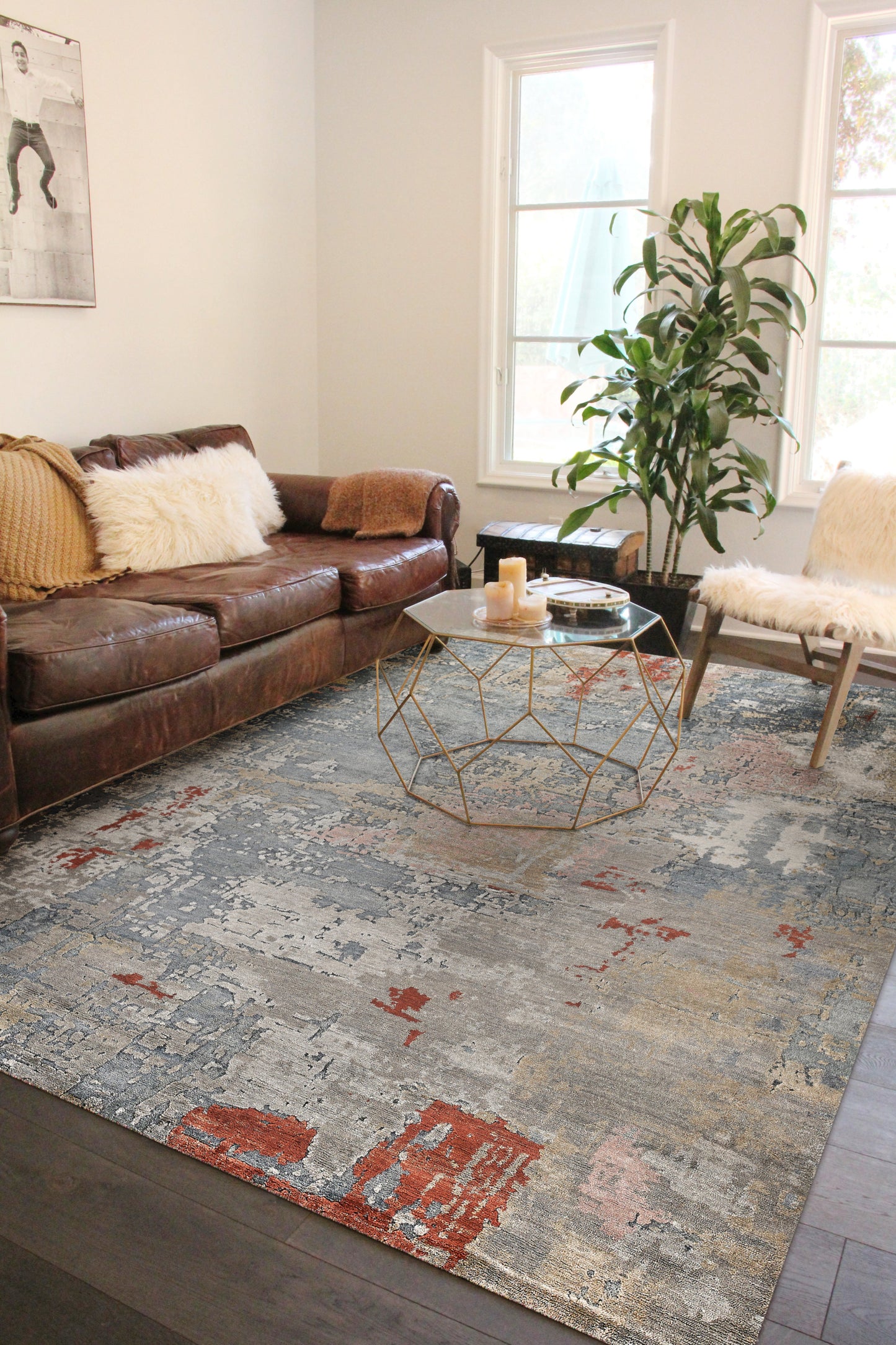 Blue indoor hand-knotted area rug, 6' x 9', on the floor.