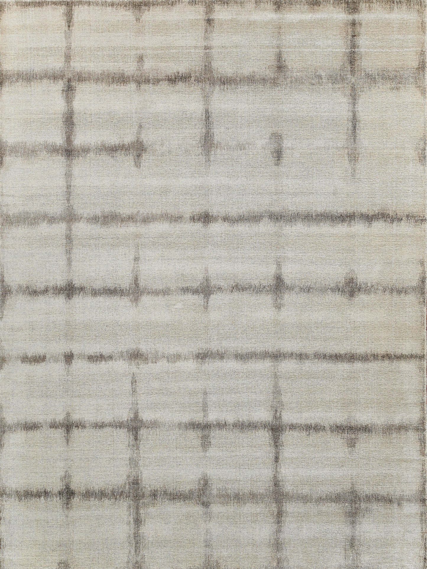 Cream woven rug with subtle gray-brown grid lines; soft textured weave, modern plaid style.