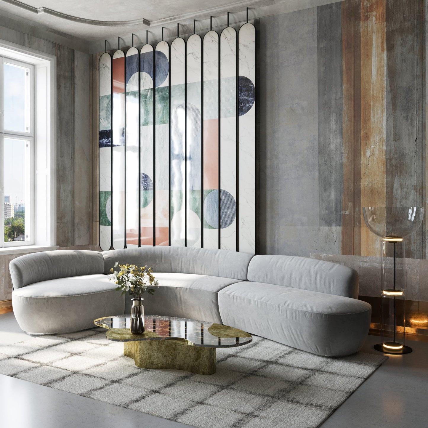 Light-gray handloomed rectangle rug, 6' x 9', in a modern living room with abstract multi-panel wall art and a glass coffee table.