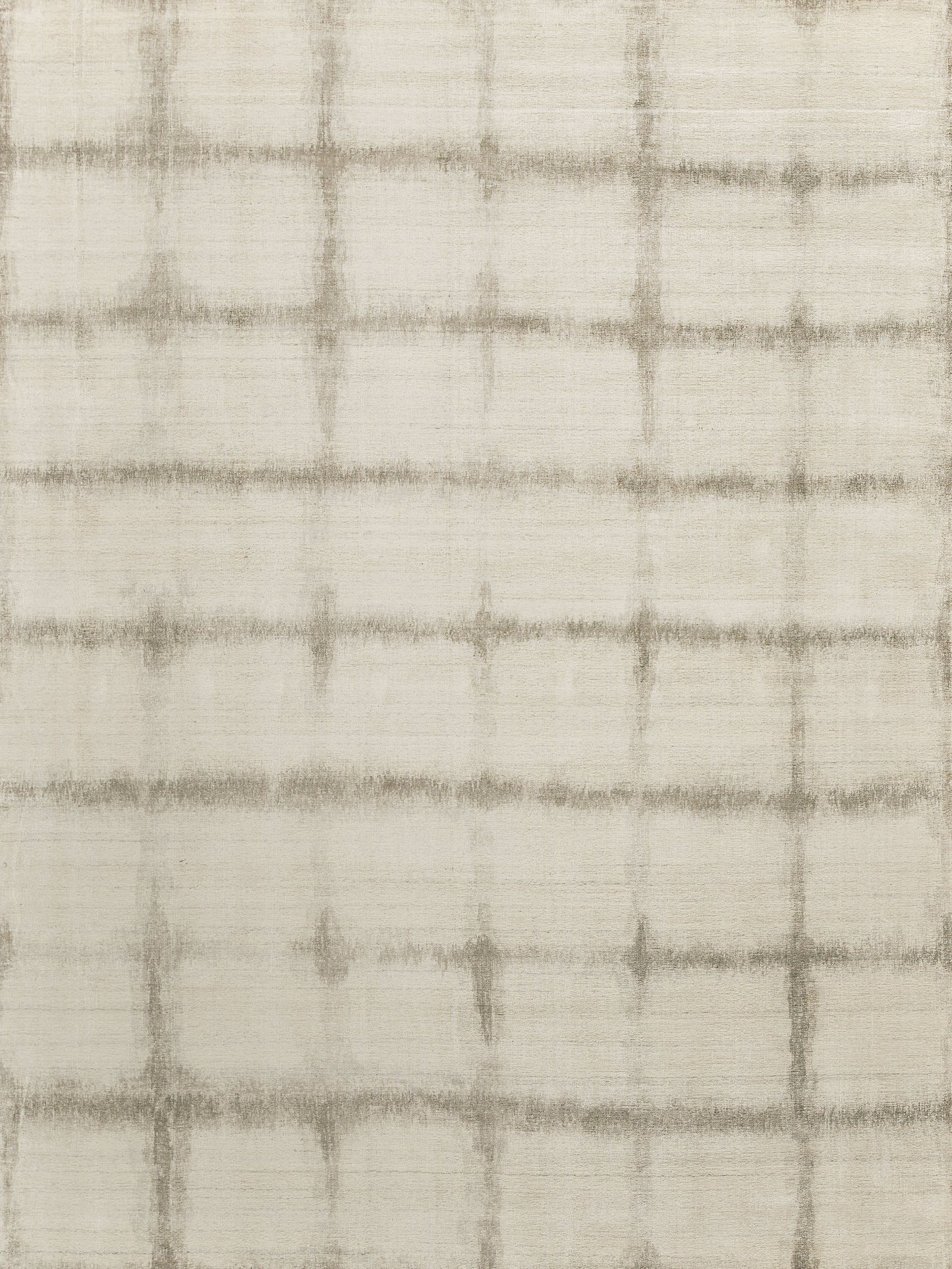 Neutral light beige area rug with a soft, textured surface featuring a subtle grid pattern in darker beige tones.