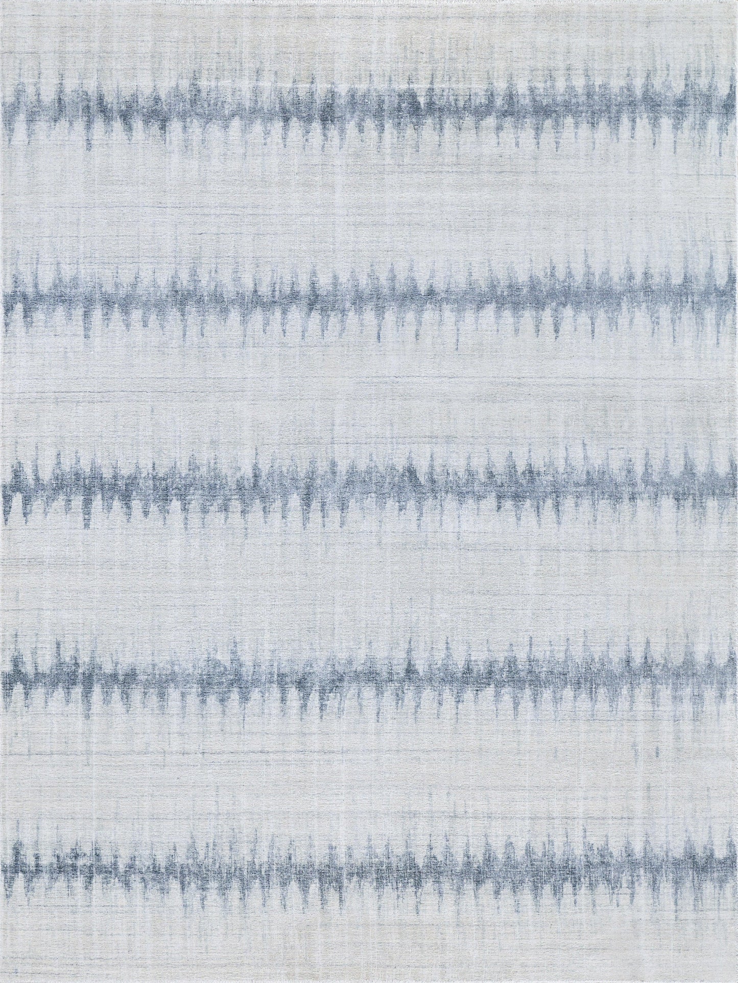 Blue-gray striped rug with soft wavy bands on a pale background; rectangular rug for living room decor.