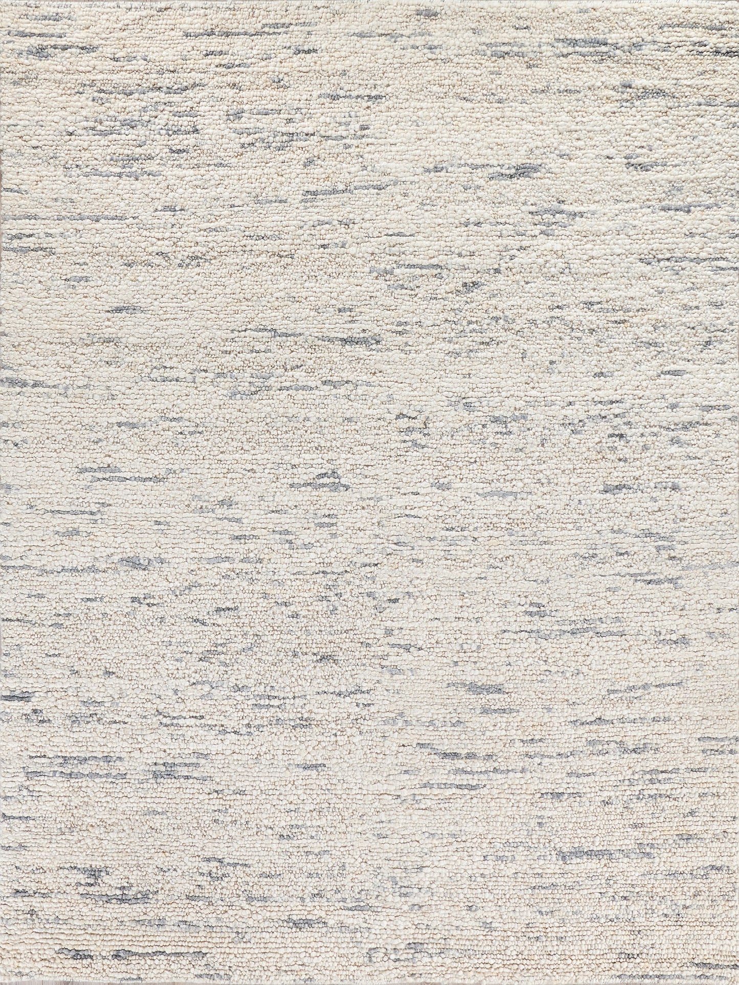 Textured rectangle area rug in soft cream with subtle gray threads, featuring a modern, abstract pattern. Ideal for cozy interiors.