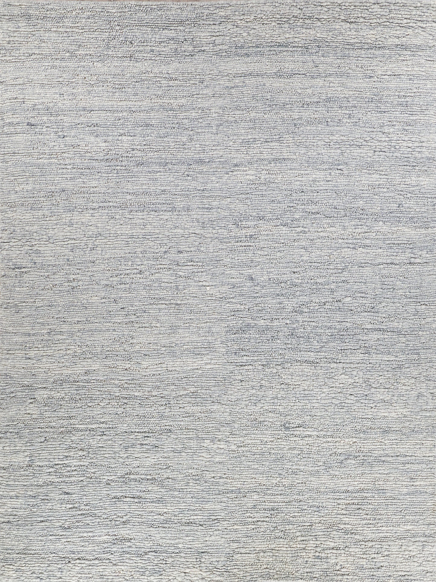Textured gray rug with a soft, woven surface; features a subtle pattern of light and dark fibers for added depth.