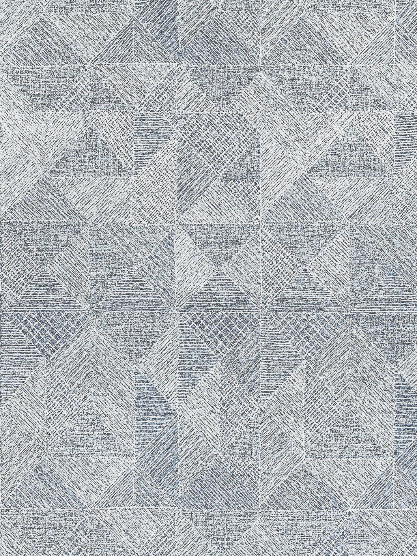 Geometric pattern on a soft blue and white rug with layered triangles and textured detailing, suitable for modern decor.