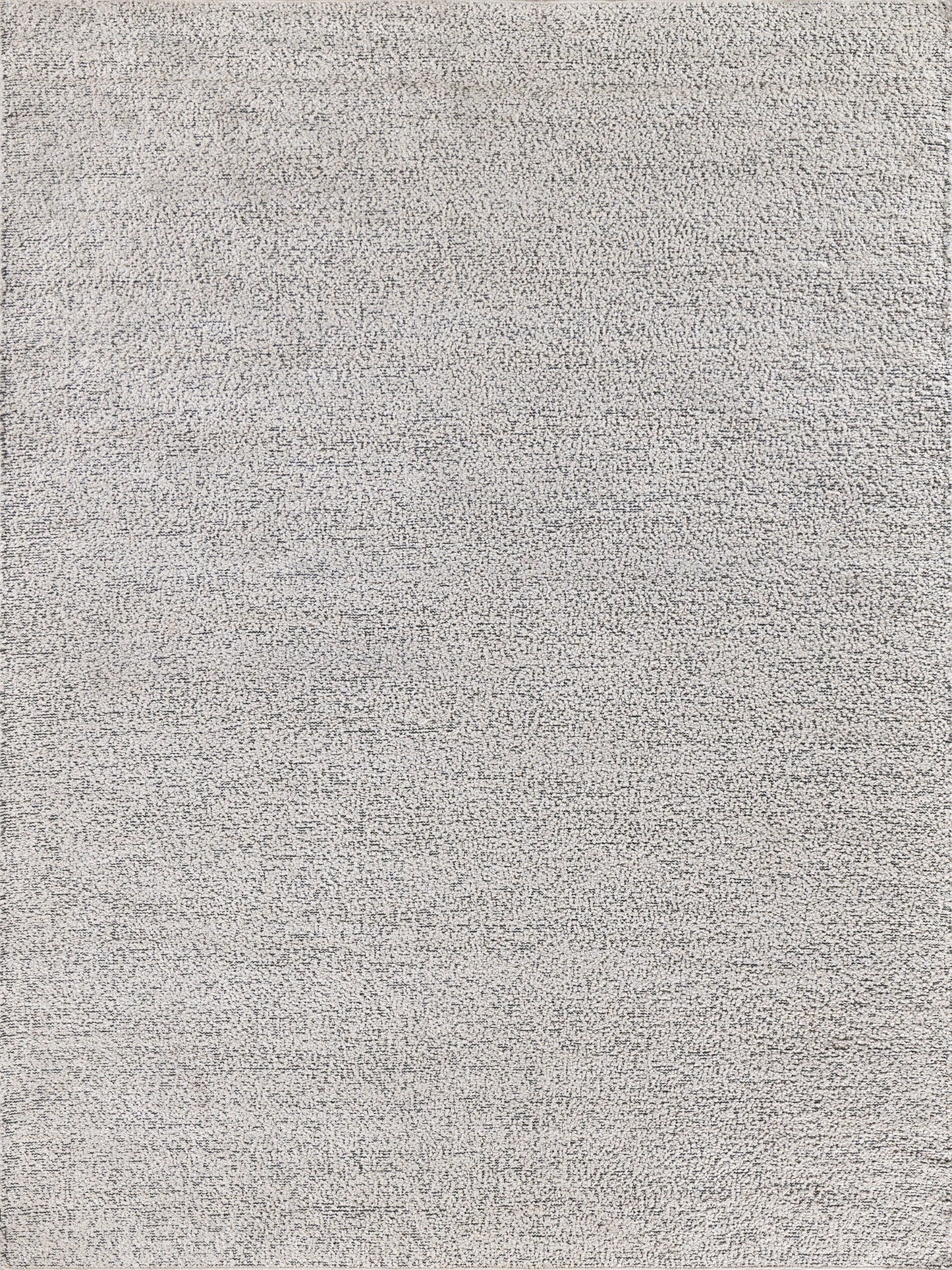 Light gray textured rug with speckled loop pile; indoor/outdoor hand loomed, 4'x5'.