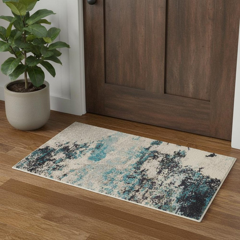 2' X 4' Ivory And Teal Blue Abstract Power Loom Non Skid Area Rug