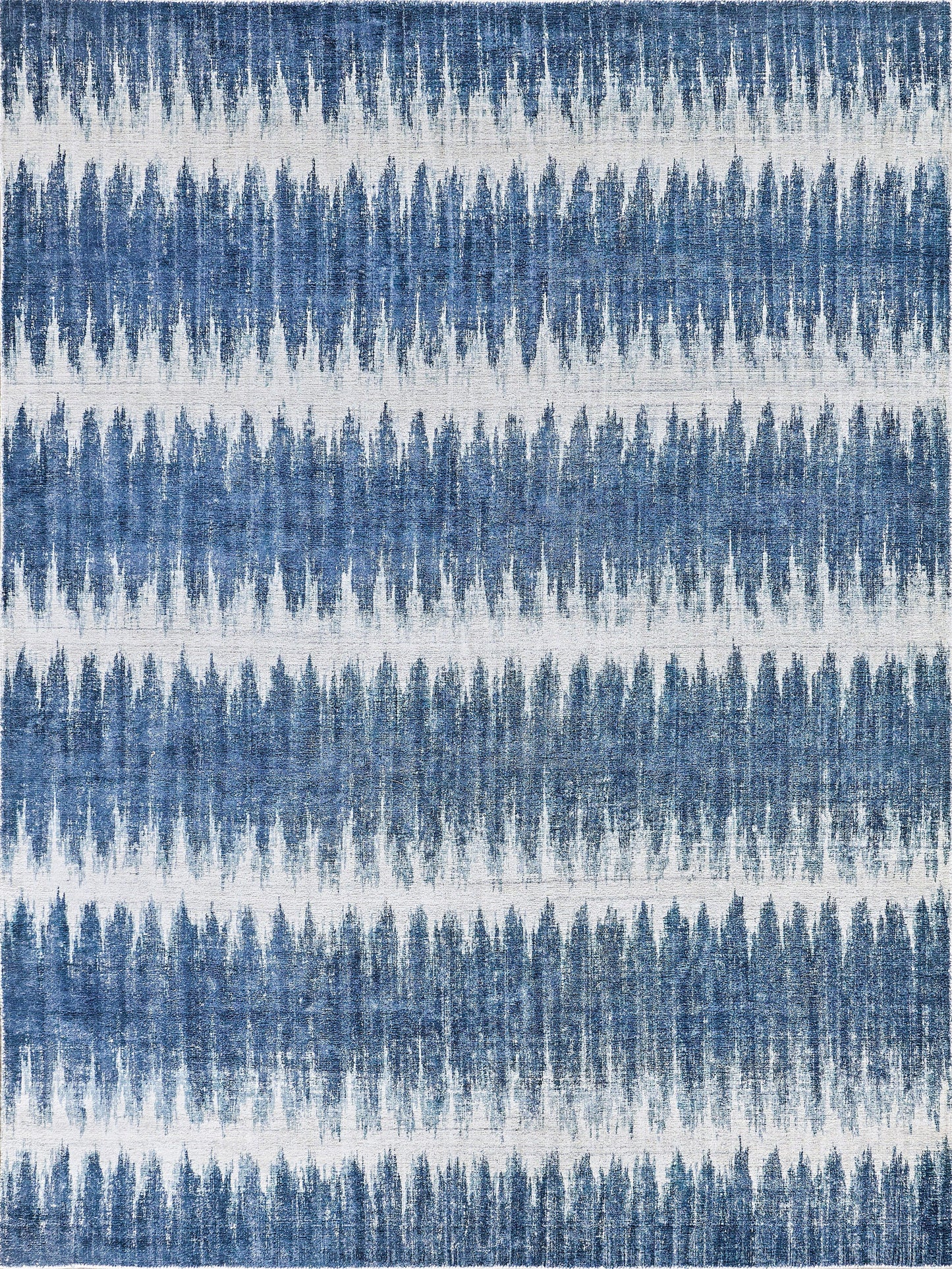 Blue and white abstract striped area rug featuring a soft, textured design with varying shades of blue in a layered pattern.