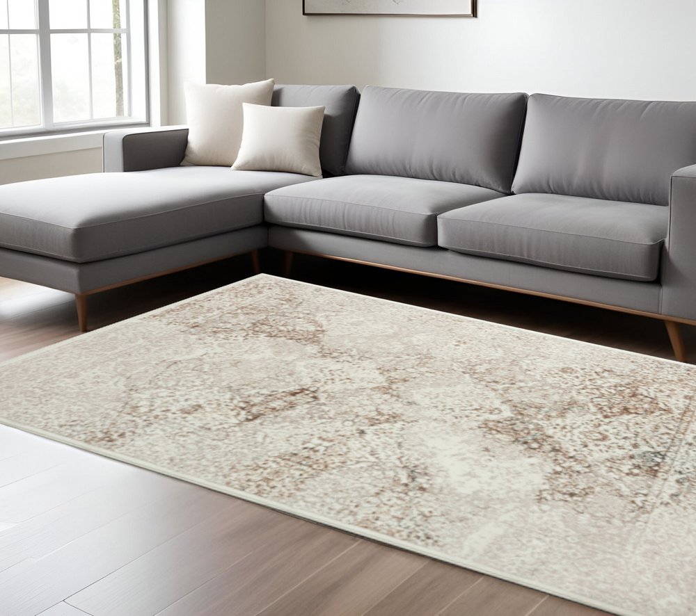 7' X 9' Beige Cream And Brown Damask Stain Resistant Area Rug