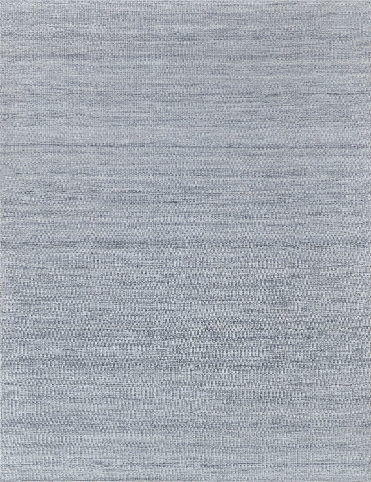 Light blue-gray woven rug with subtle heather texture.