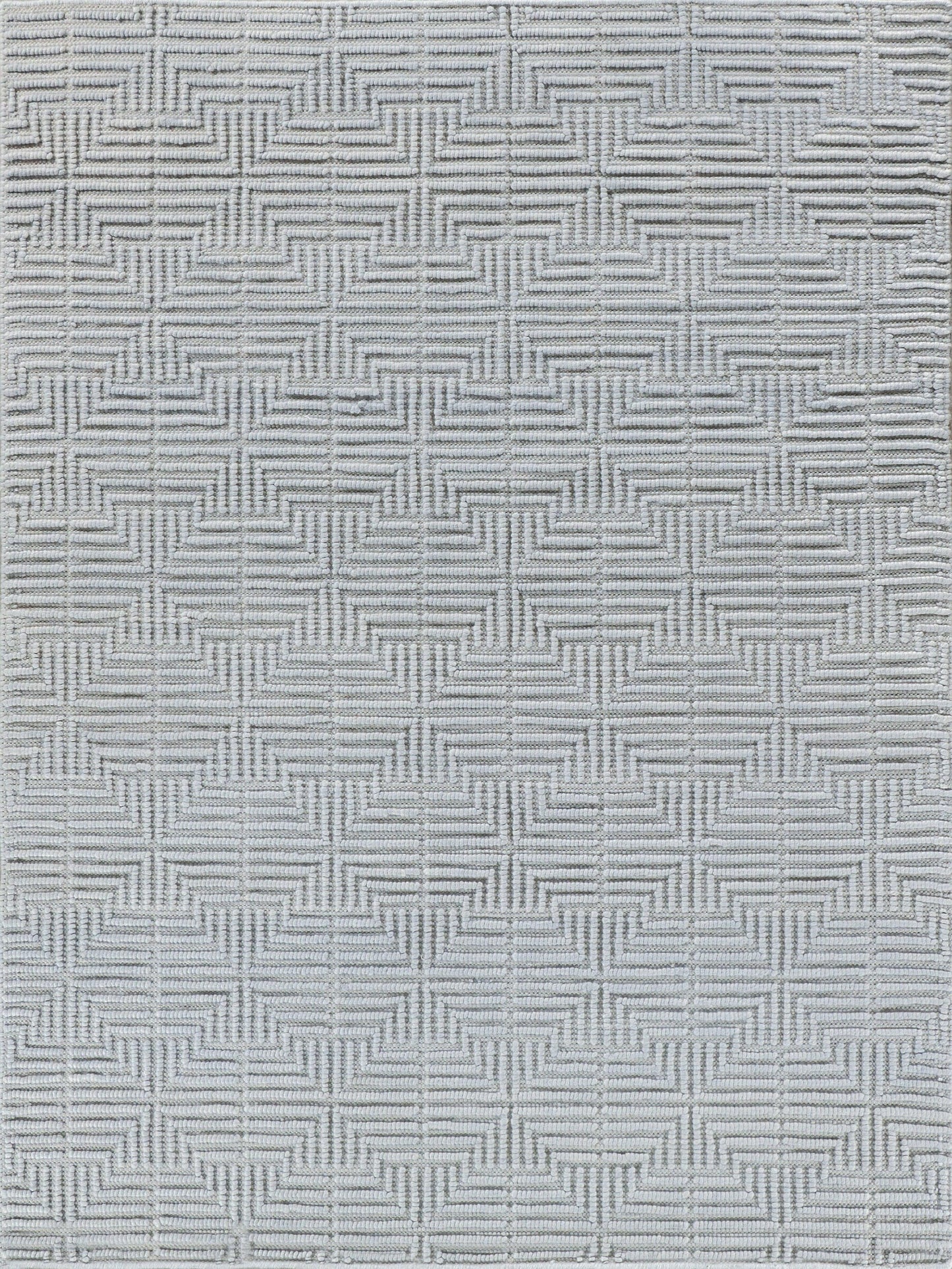 Light gray woven rug with a repeating geometric cross-hatch square pattern.