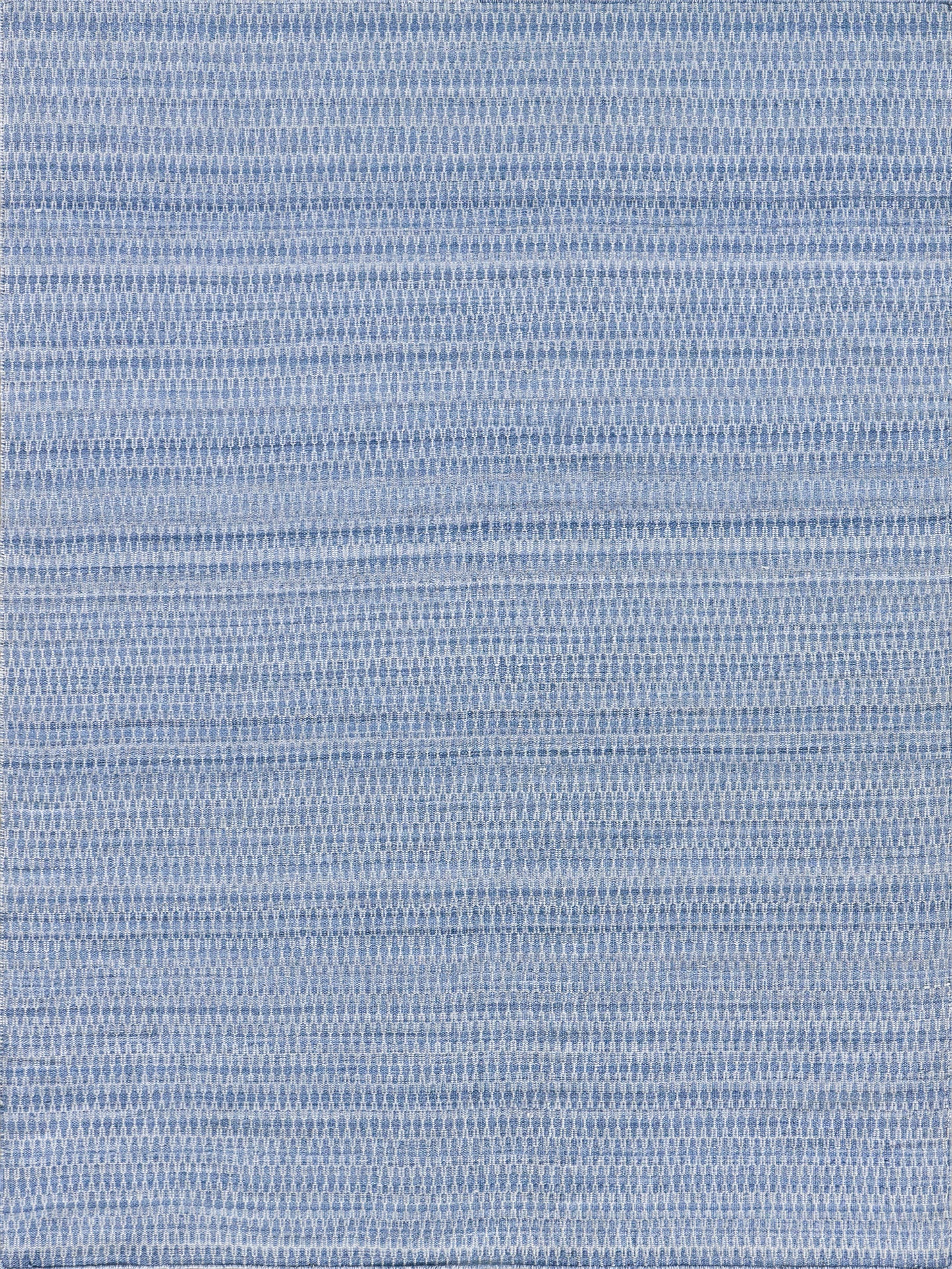 Light blue flatweave rectangular rug with a subtle woven texture.