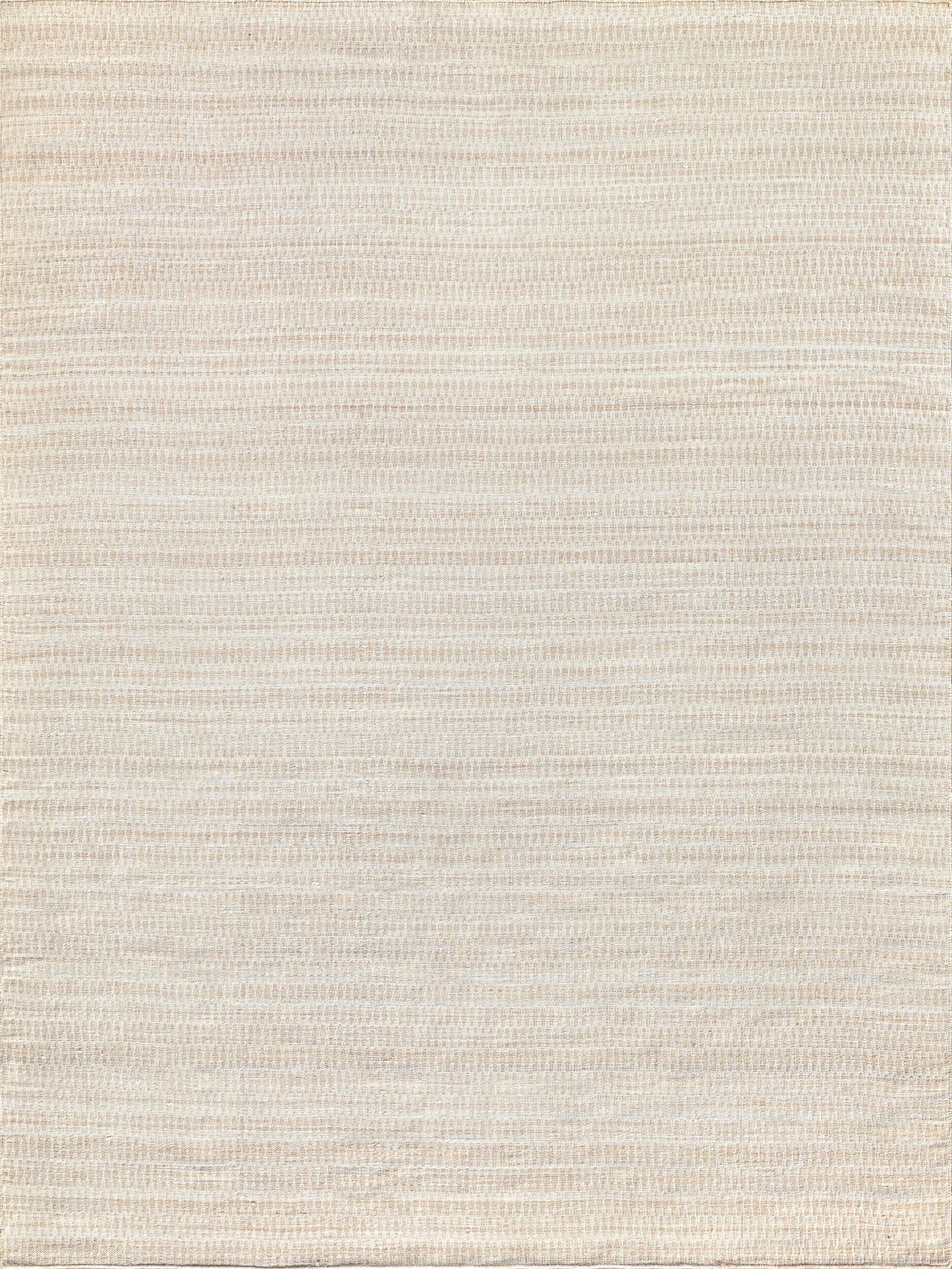 Flatweave rug in soft beige tones with a subtle striped pattern and a textured surface.